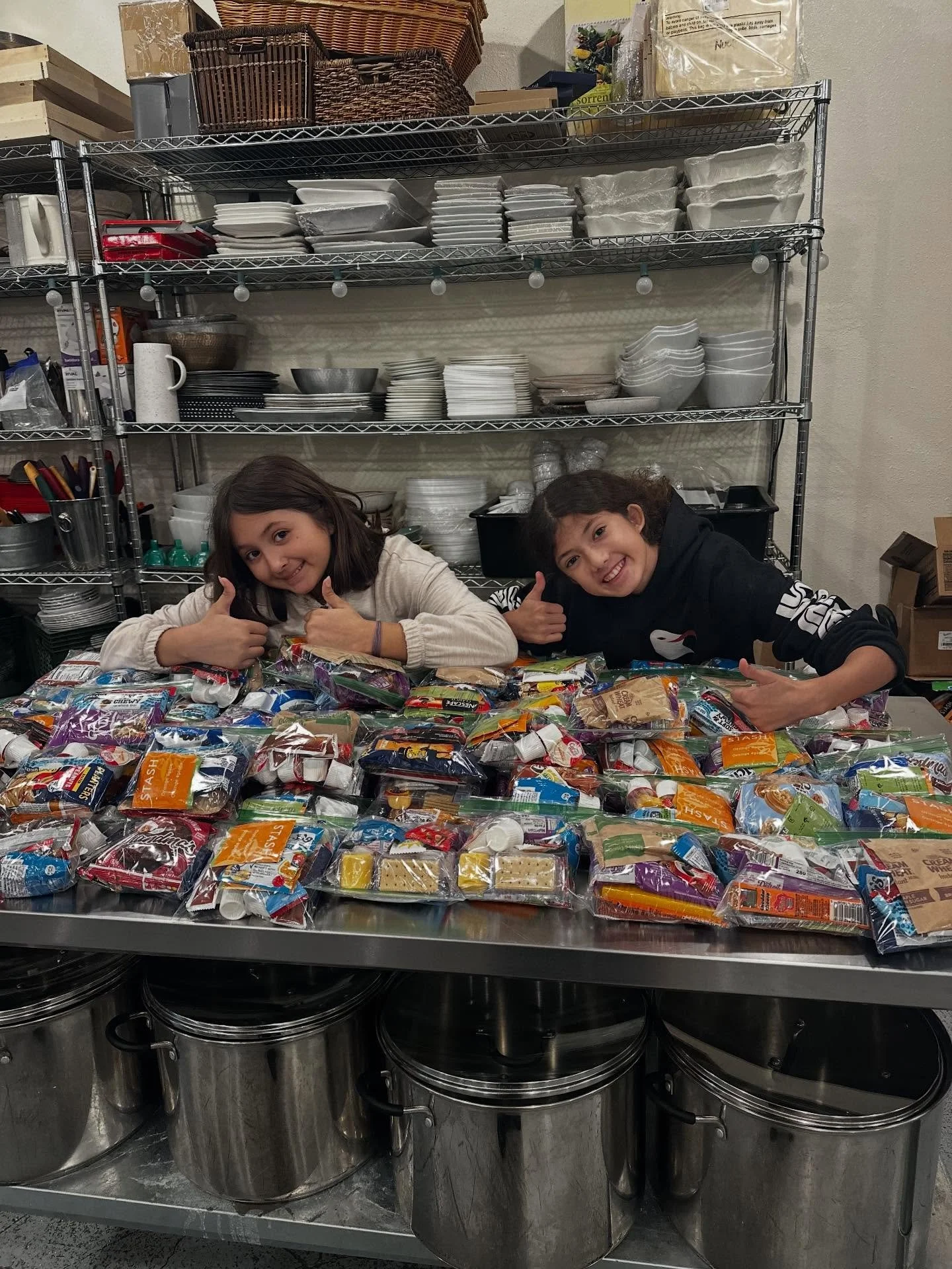 Thank you to Amy, Emma &amp; Penelope for packing 100 snack bags for our seniors this afternoon.  We did invite Emma &amp; Penelope to enjoy a few snacks while packing the bags for our seniors!  Lots of fun and great to connect our youth with our sen
