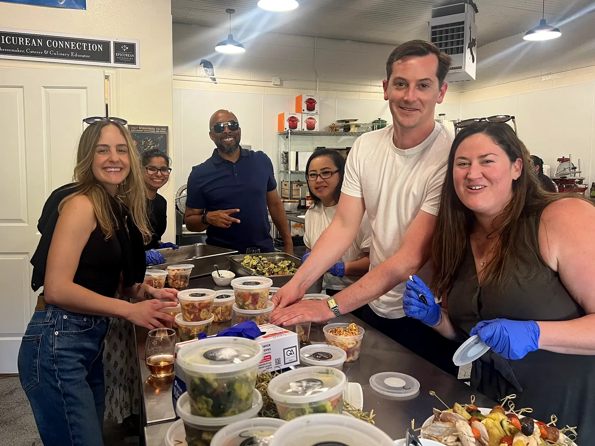 Philanthropy culinary class students prepping meals to go