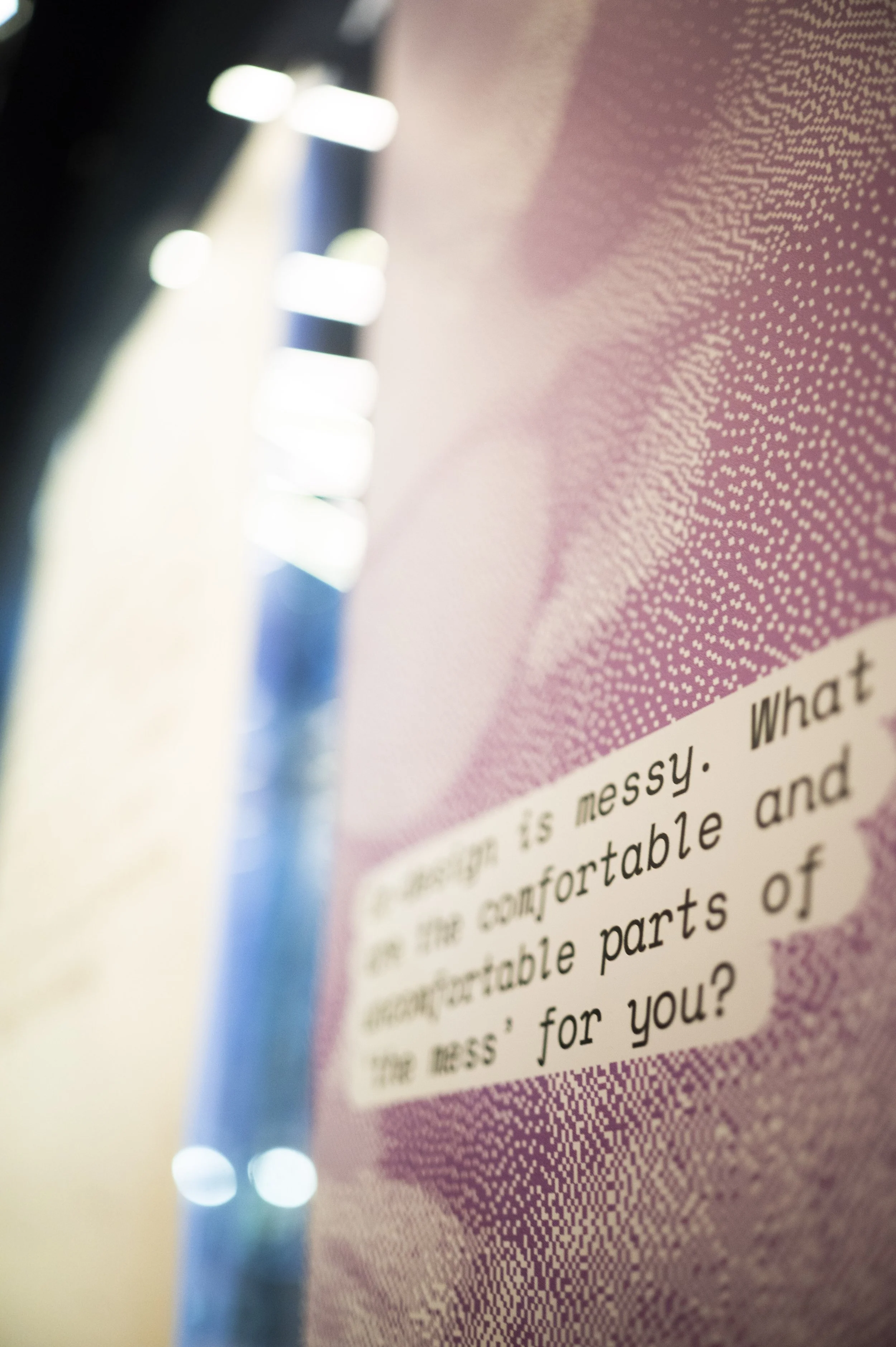 A blurred image of a poster on a glass wall