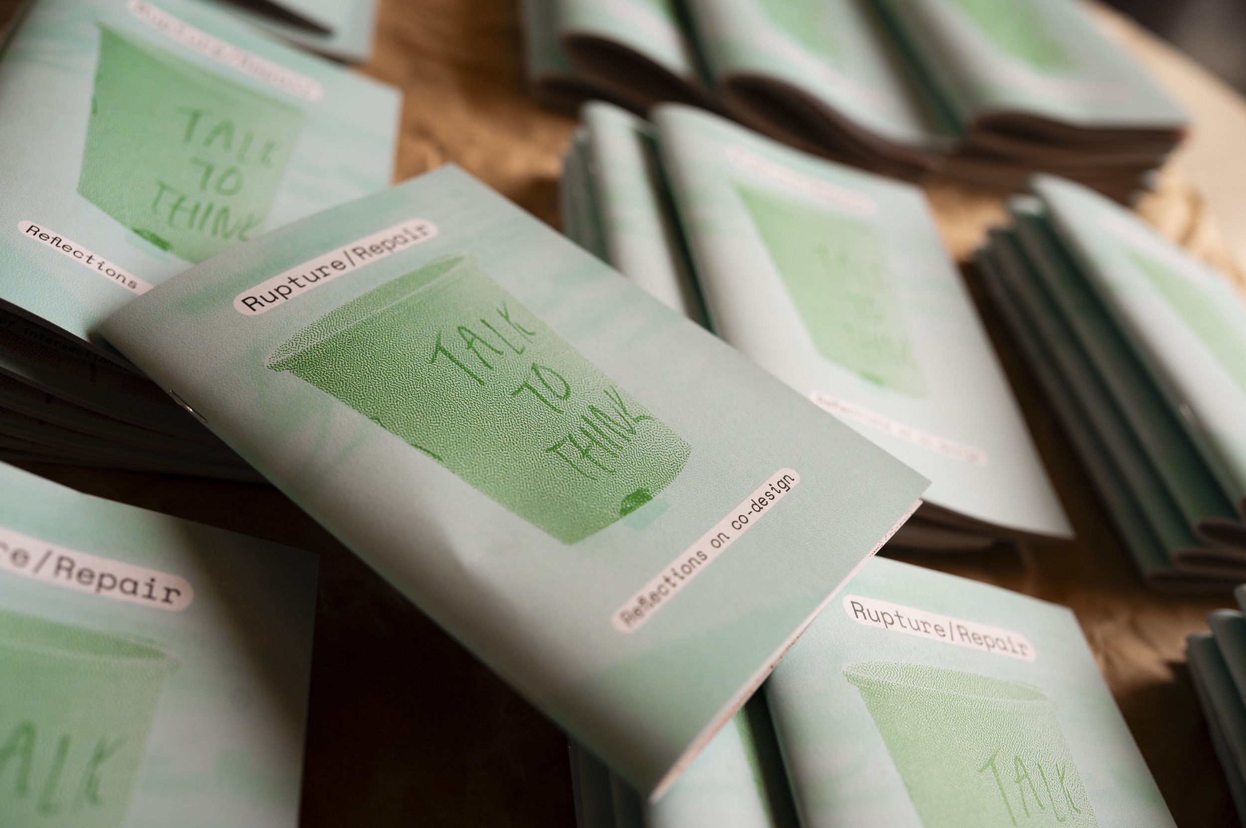 An image of a pile of zines titled 'Rupture/Repair: Reflections on Co-design'