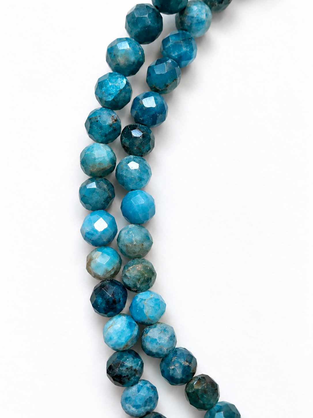 Faceted Blue-Green Gemstone Bead Strands.png