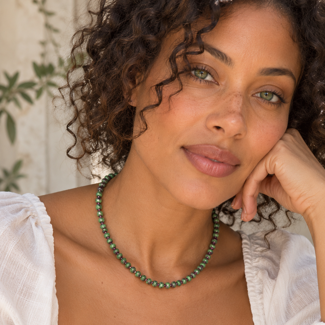 Sunlit+Curly-Haired+Portrait+with+Gemstone+Necklace.png