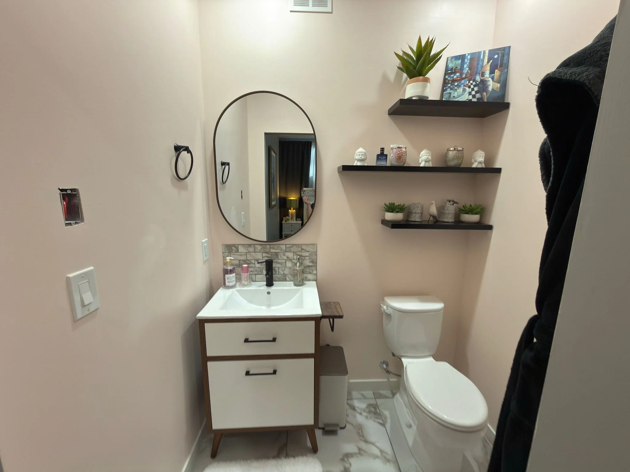 Beautiful two piece sink and toilet provided in room.