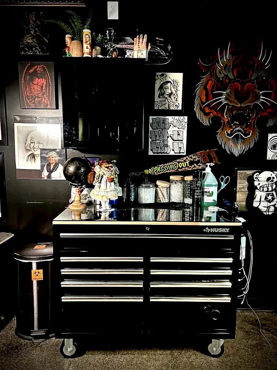 Mommasboy Tattoo workspace with tattoo materials, ink, custom designs in Austin, Texas. This is where Johny Vasquez tattoos his clients.