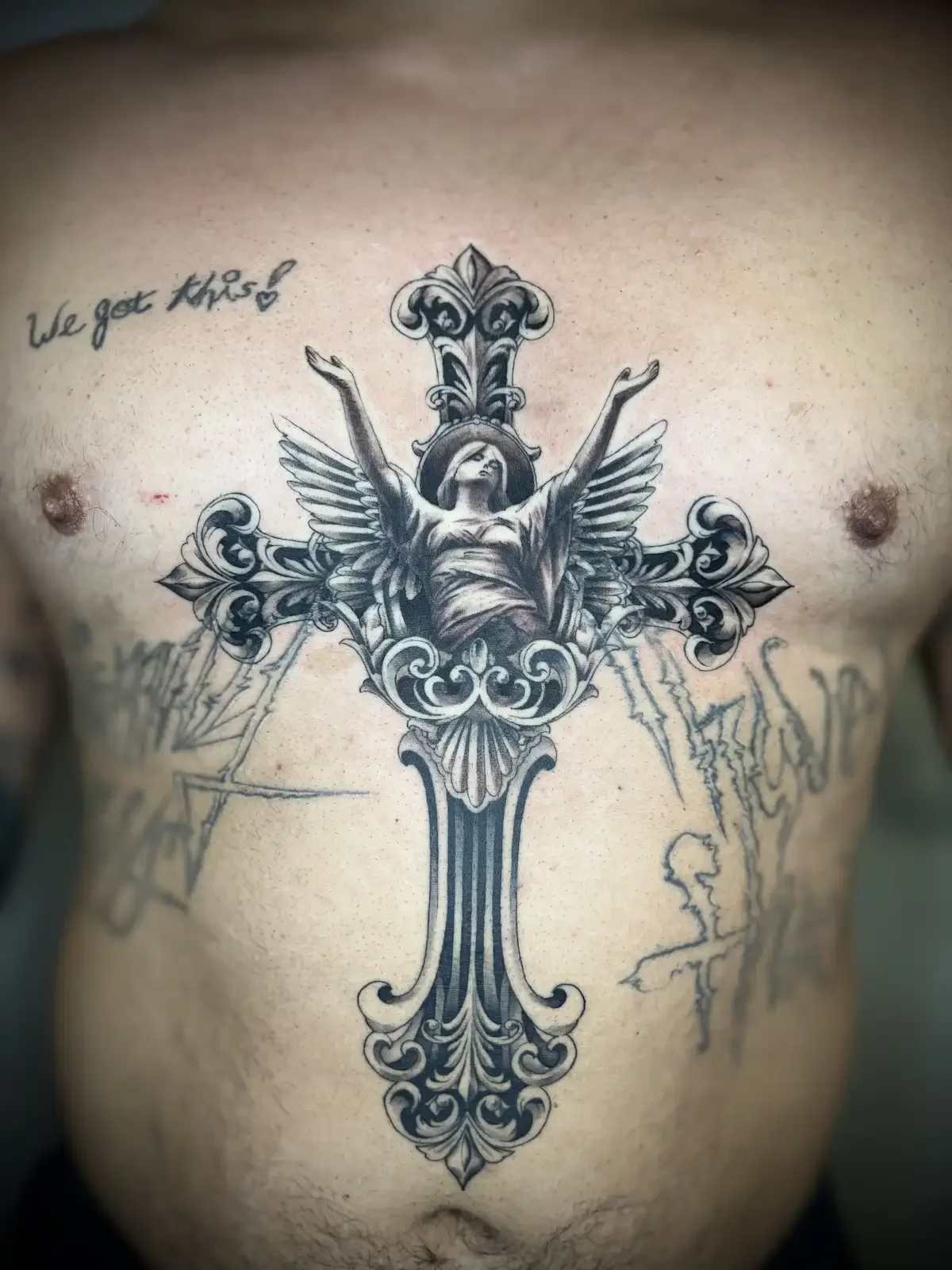 Black and grey religious figure with wings and ornate cross tattoo by Austin tattoo artist Johny Vasquez — Mommasboy Tattoo