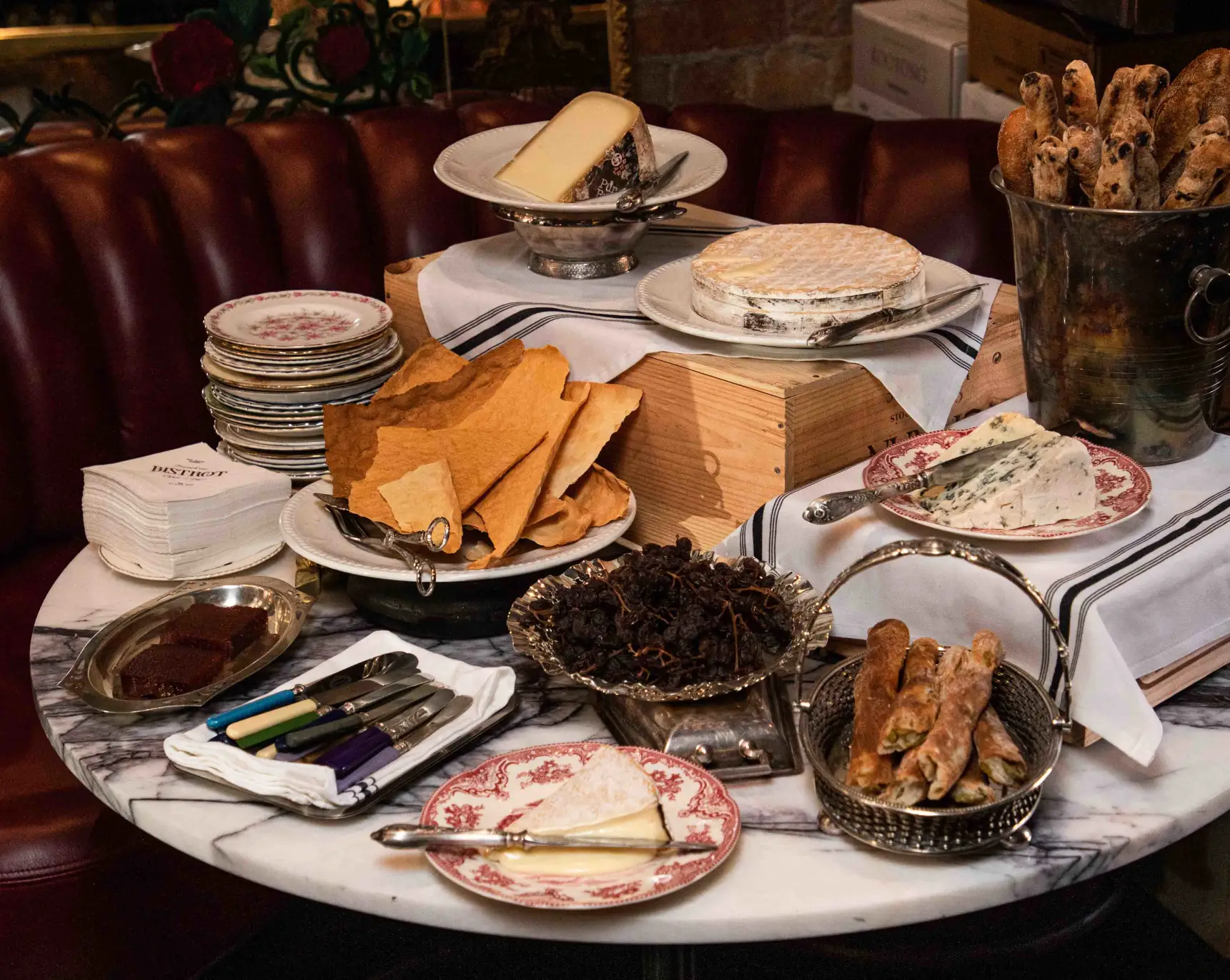 A cheese and charcuterie board on a marble table for a private event at Smith St Bistrot