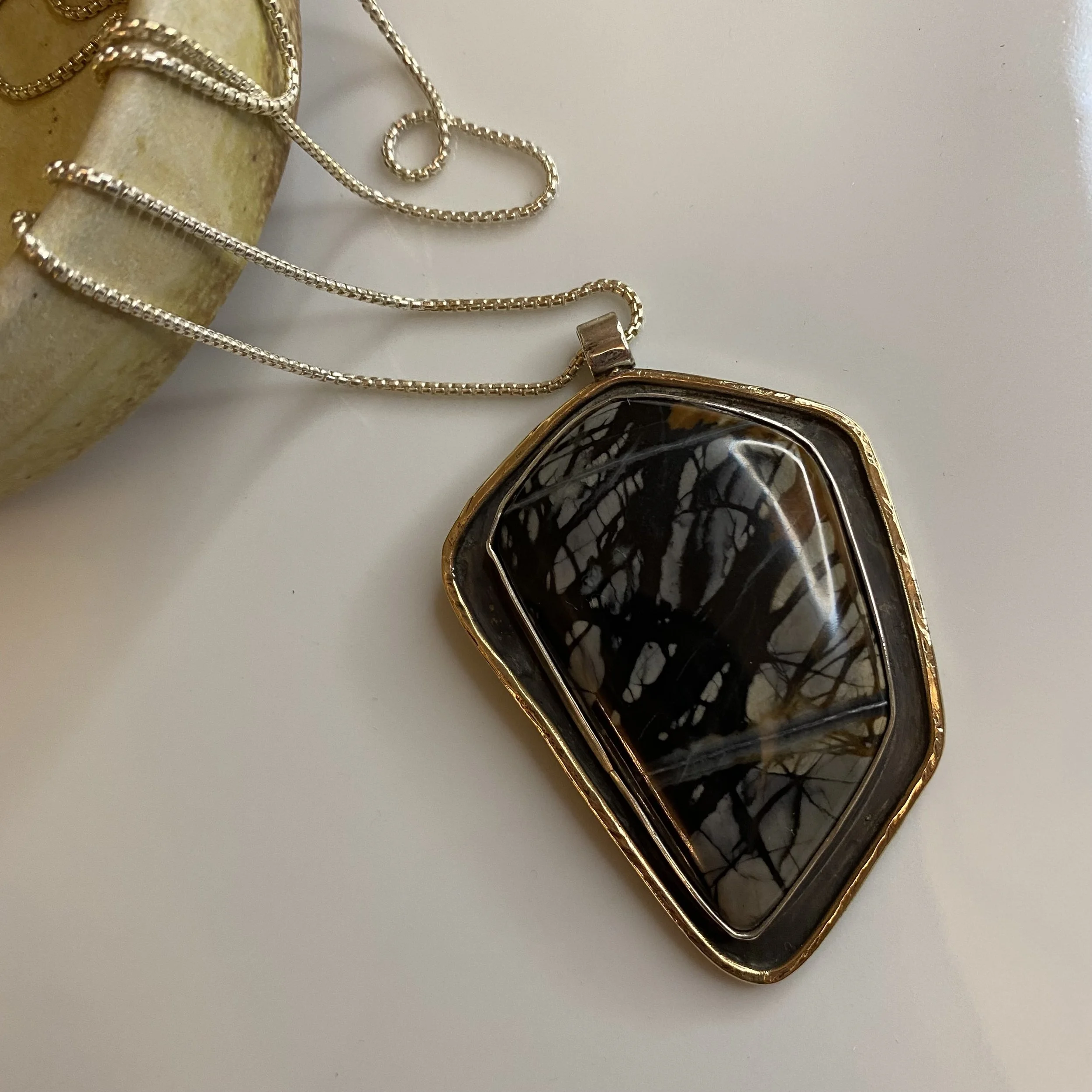 Statement Picasso Jasper & Oxidized Sterling Silver pendant with hammered brass border accent on rounded sterling silver box chain