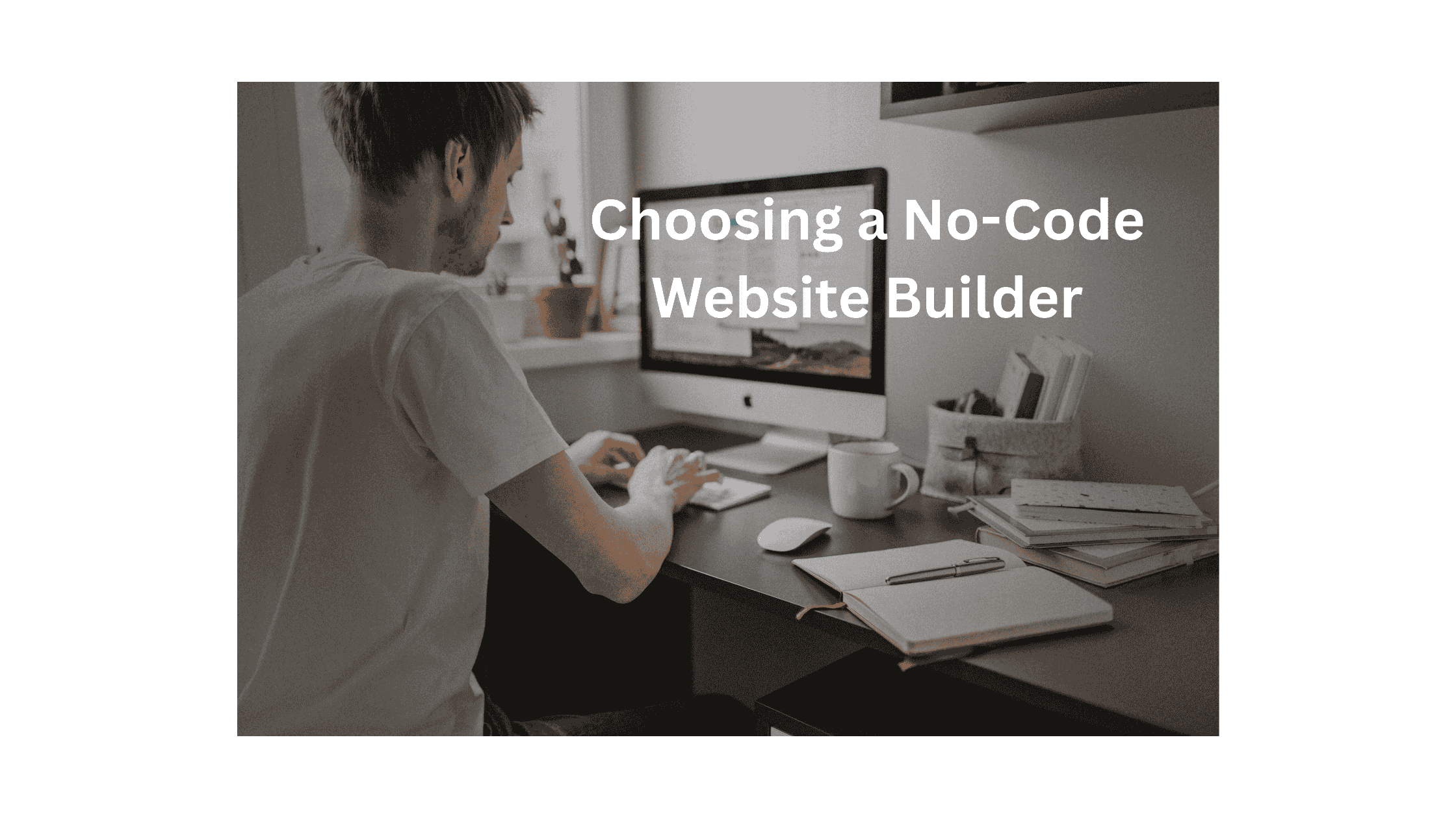 Person working on a computer using a no-code website builder in a clean, bright workspace.