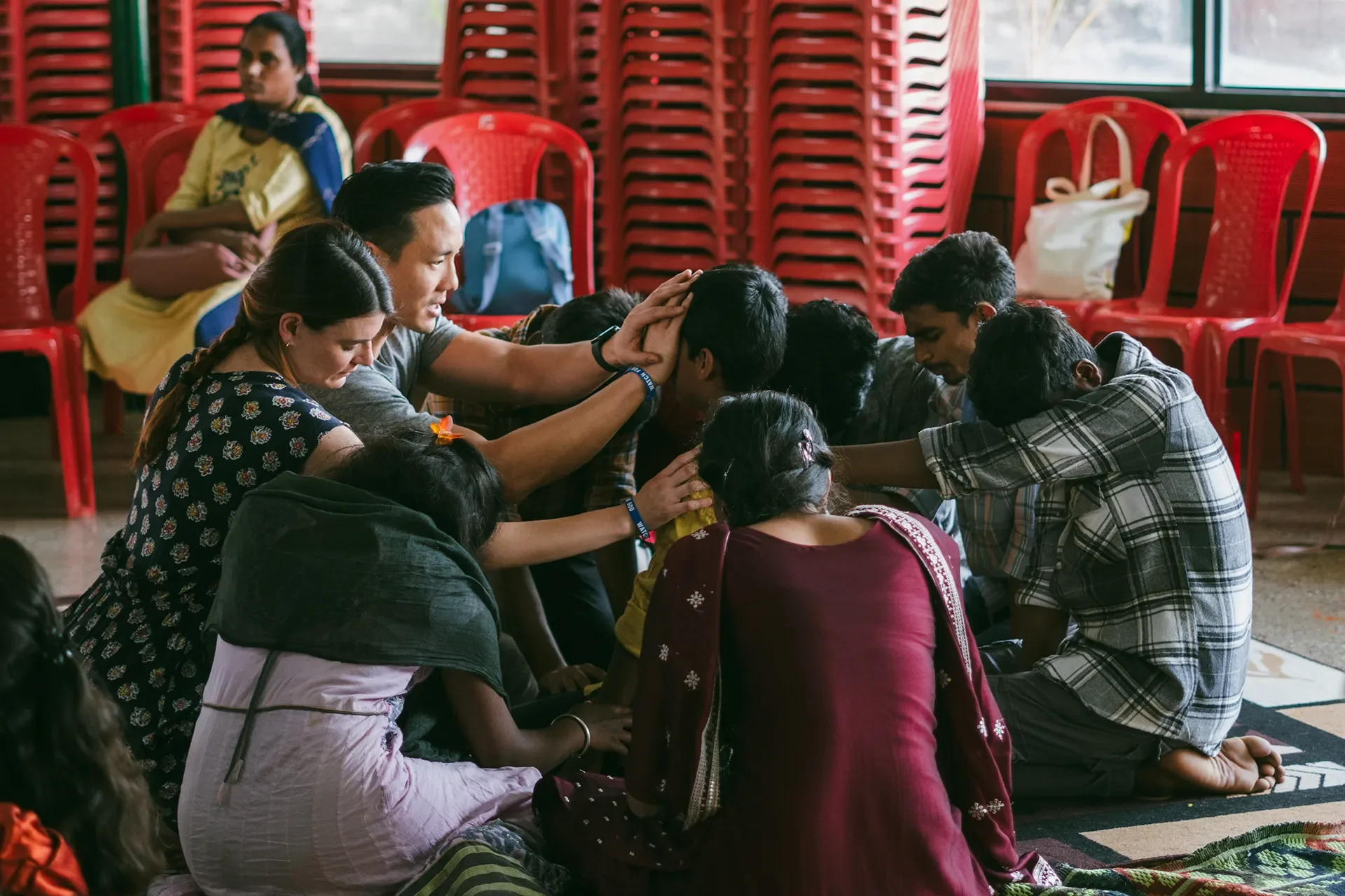 Missions team prays over children