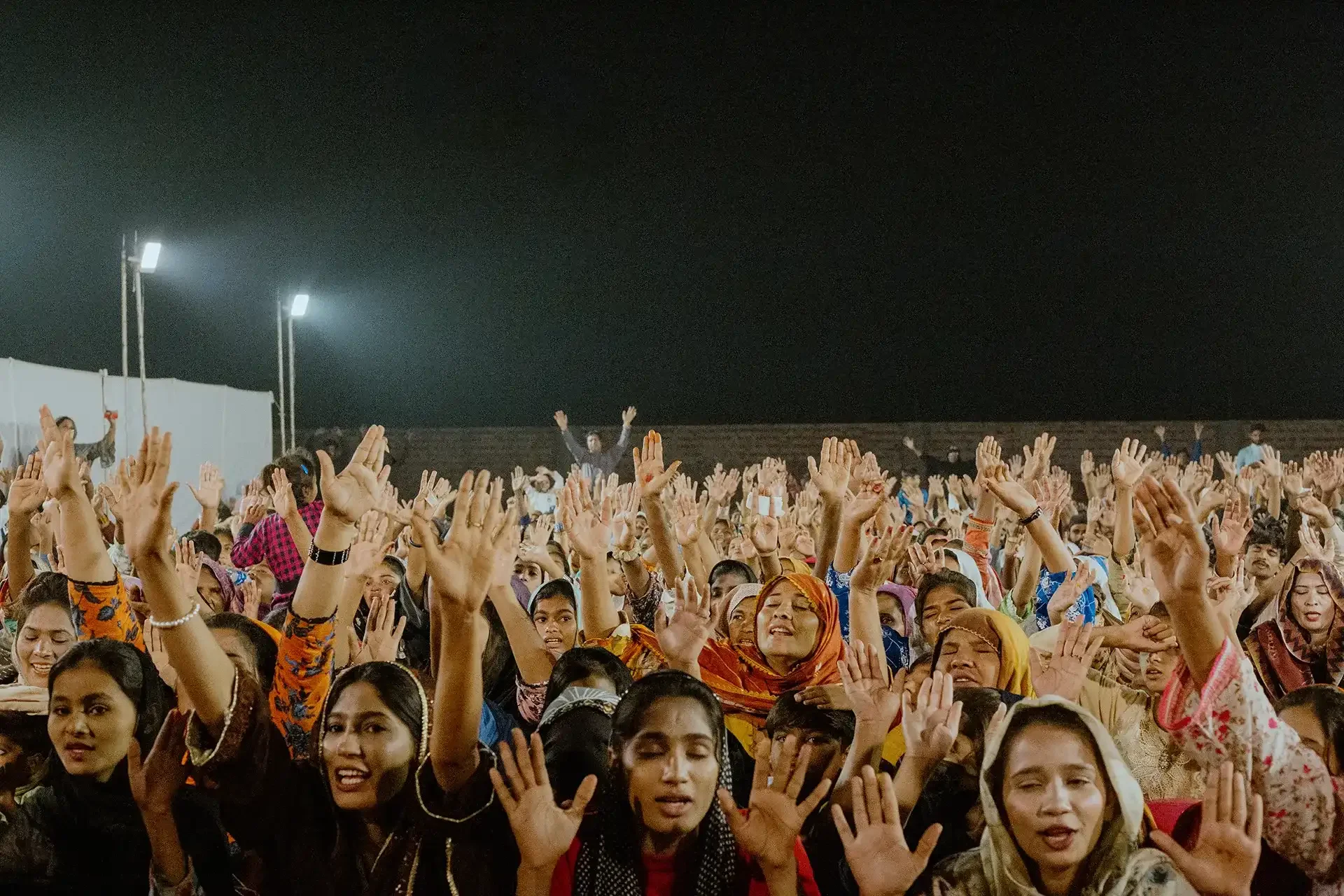 People worshipping at night