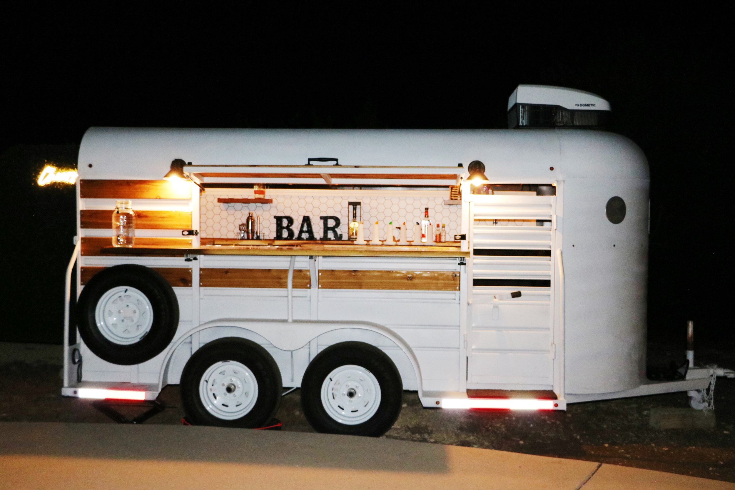 Mobile bar with built-in photo wall for wedding receptions near New Braunfels, Texas