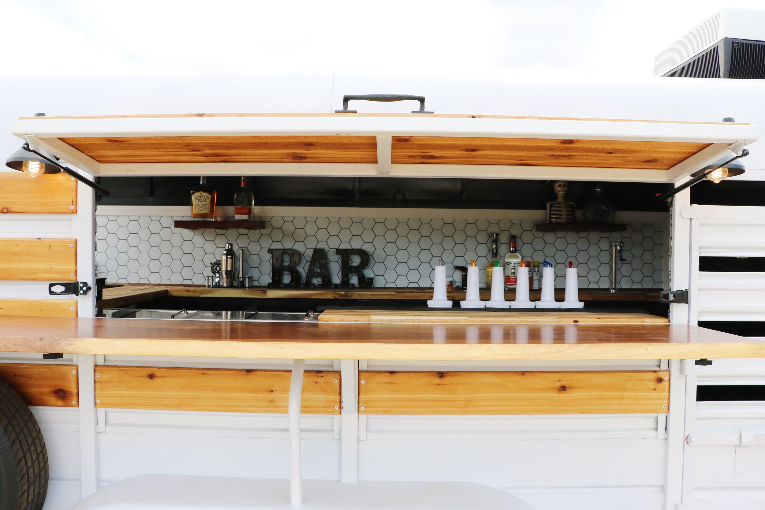 Custom-built bar trailer set up for outdoor parties and events in Seguin, Texas