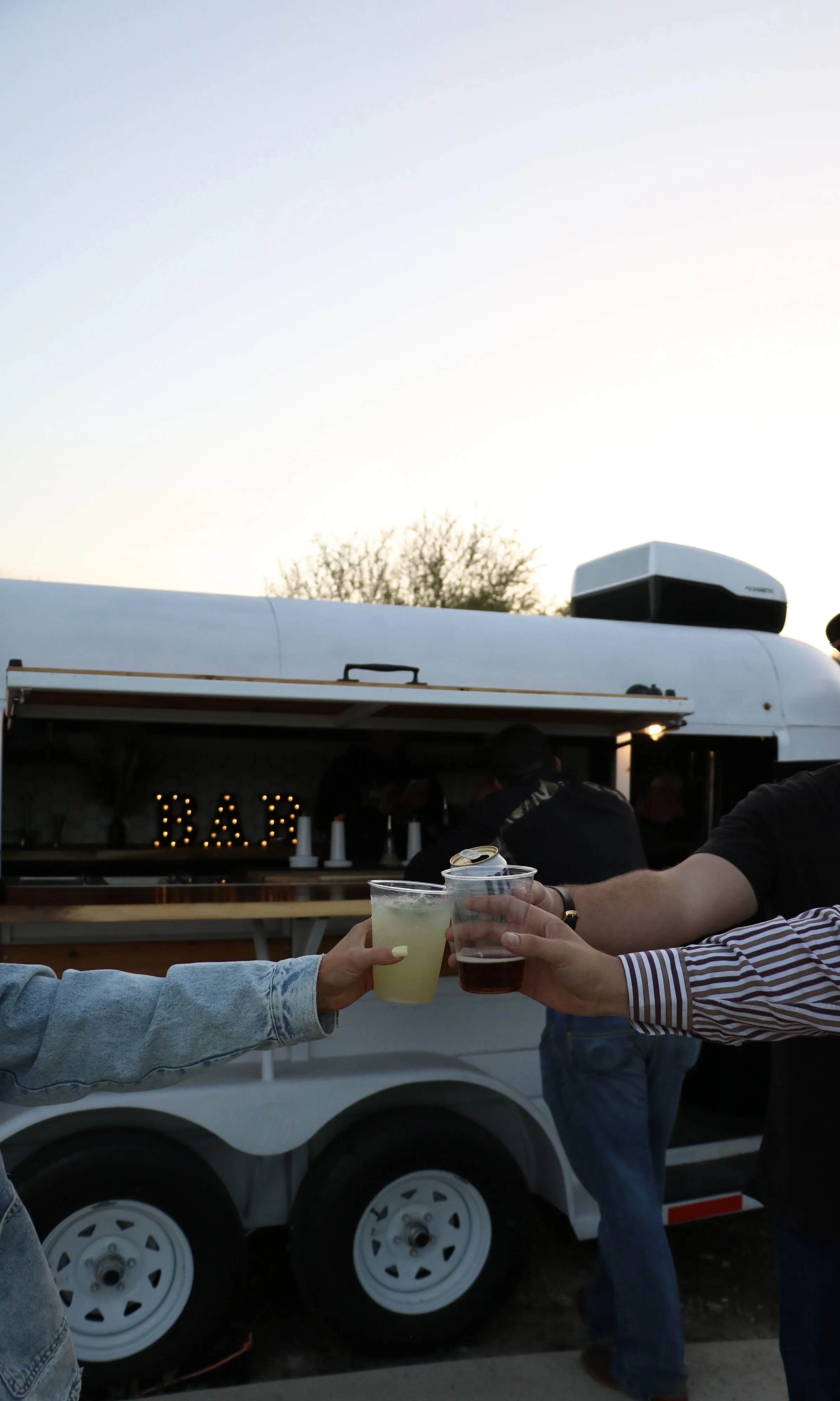 Mobile bar with built-in photo wall for wedding receptions near New Braunfels, Texas