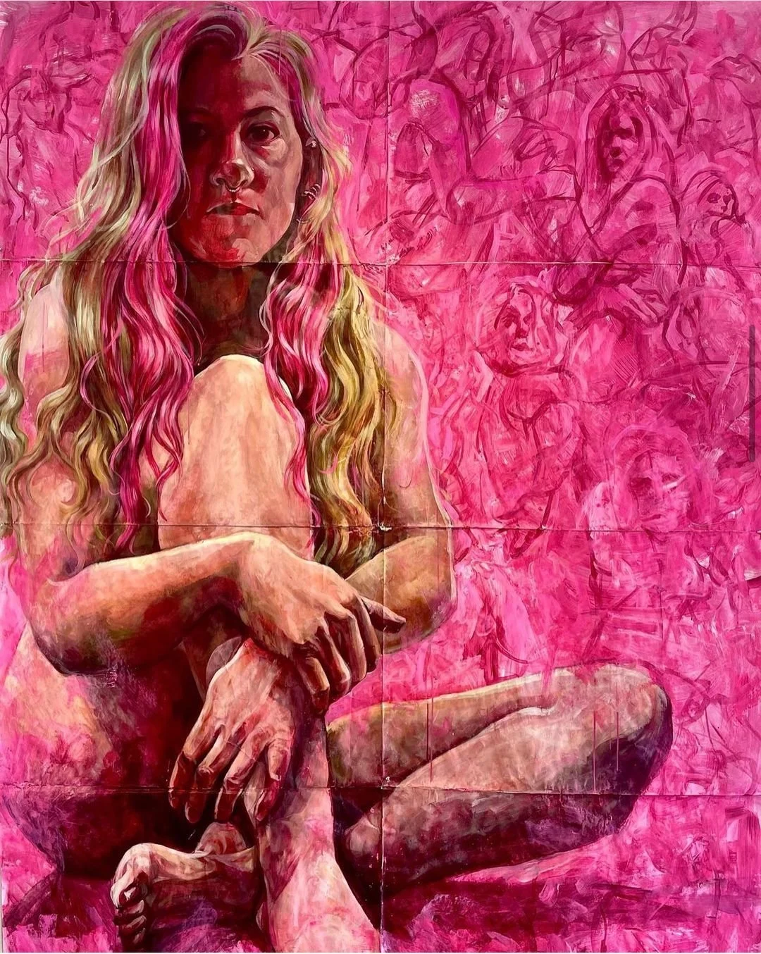 A painting of a woman with long, wavy blonde and pink hair, sitting with knees bent and arms wrapped around her legs, against a pink background with sketches of other women.
