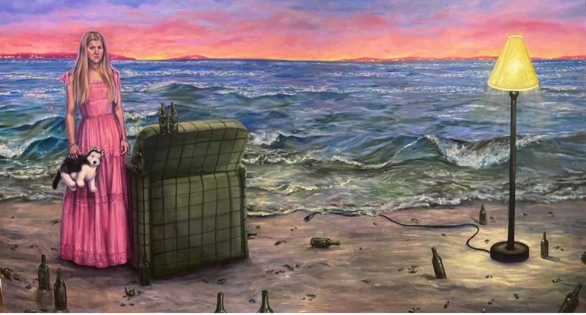 A surreal painting of a young woman in a pink dress standing on a beach at sunset, holding a husky puppy. An old green armchair and a yellow lampshade on a lamp stand are on the sand, with empty beer bottles scattered around. The ocean waves and a co