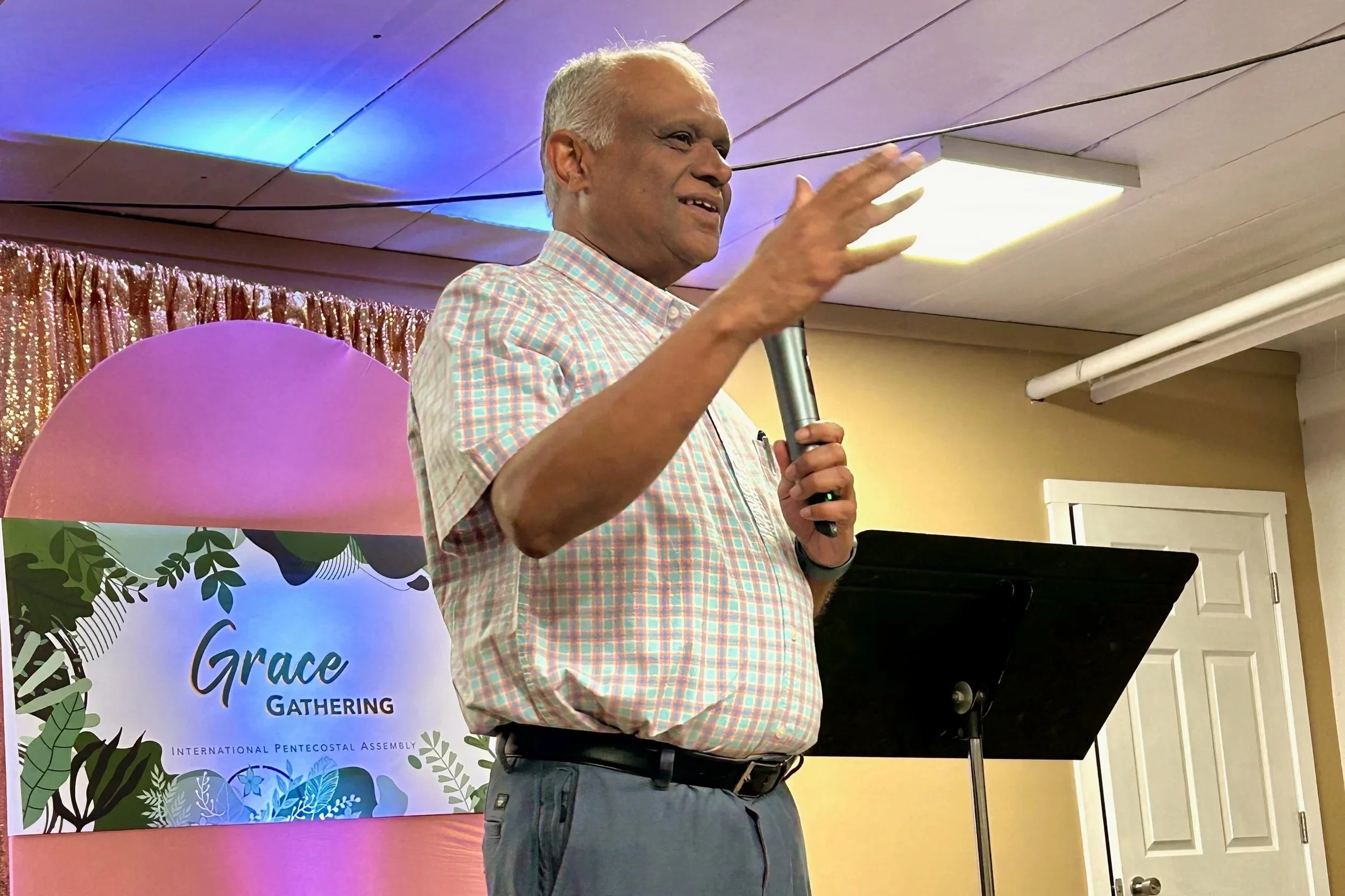 Indian Christian speaking at the Grace Gathering