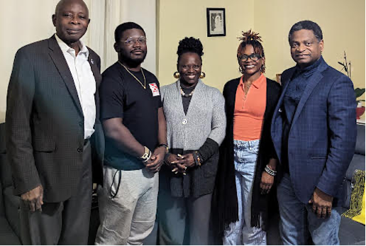 Five African individuals in a group photo