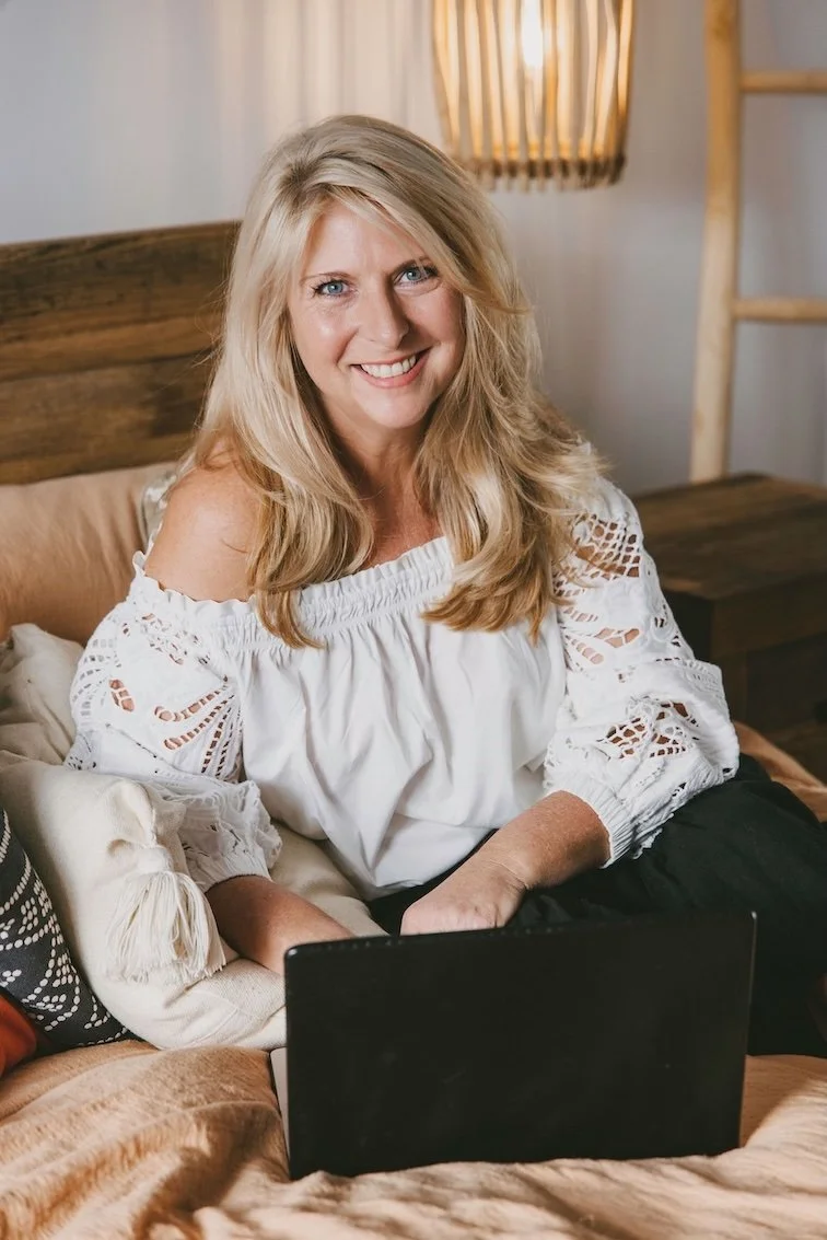 Best Human Design Teacher Australia Amber Clements sitting with laptop