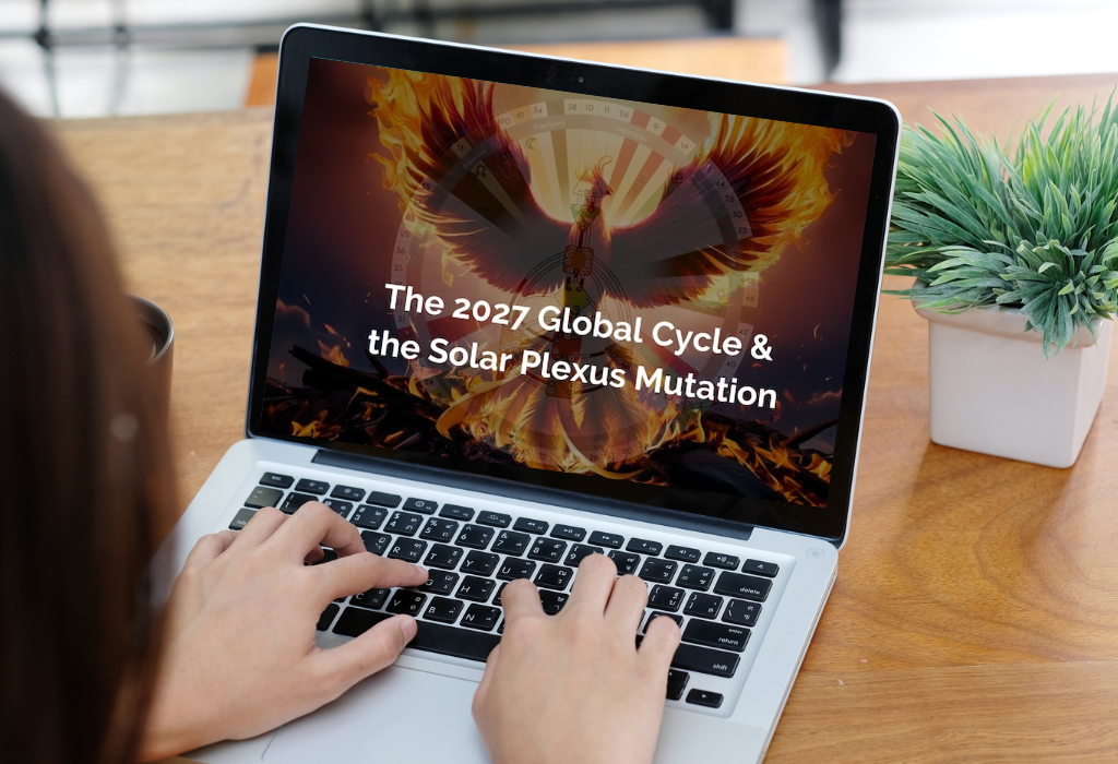 Woman's hands typing on computer with The 2027 global cycle and the solar plexus mutation on the screen
