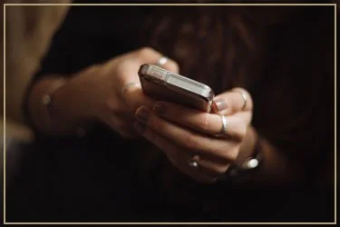 Person holding and using a smartphone.