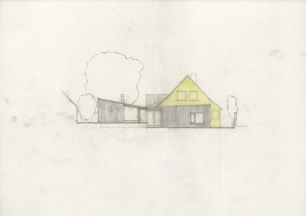 Sketch of a house with a sloped roof, partially colored yellow, and a small rectangular window on the right side, surrounded by trees.