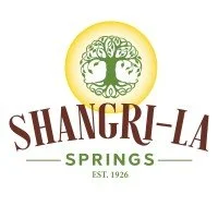 Shangri-La Springs logo with a green tree inside a yellow circle and text 'Shangri-La Springs Est. 1926'