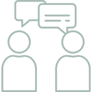 Two simplified human figures with speech bubbles indicating conversation.
