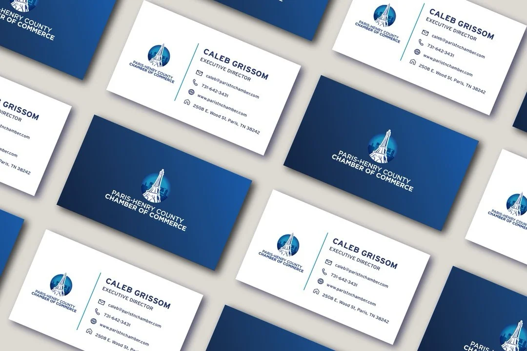 Business cards and envelopes for Paris-Henry County Chamber of Commerce, featuring the chamber's logo with an illustration of the Eiffel Tower.