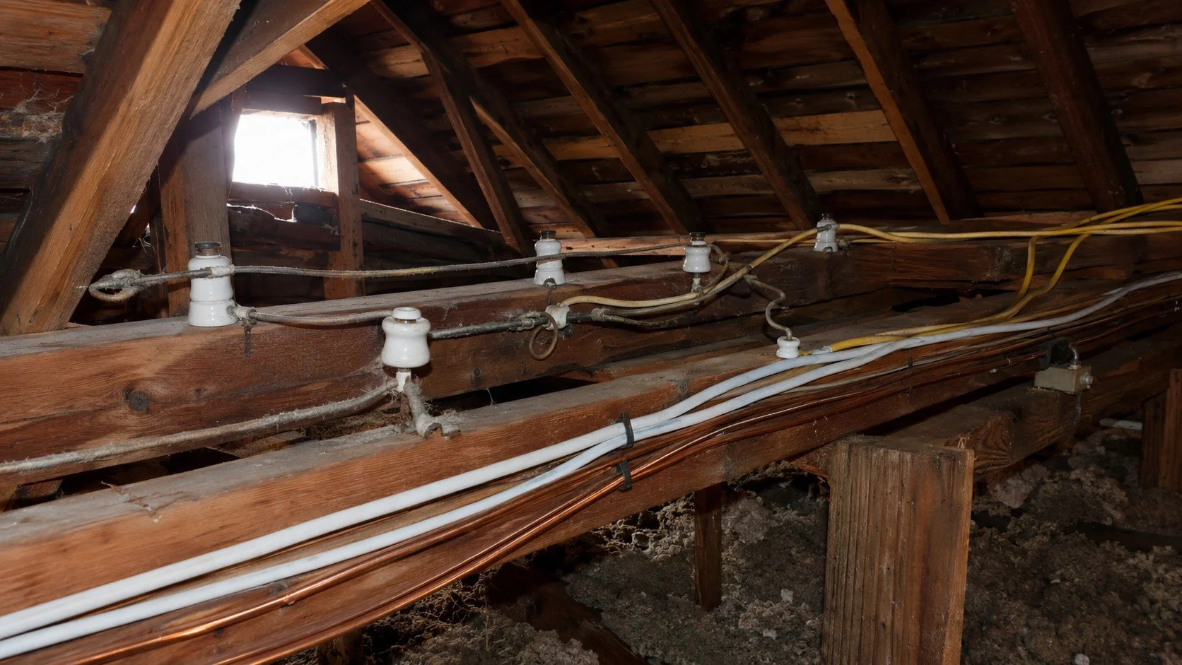 Old ceramic knob and tube wiring in an older Ontario home attic