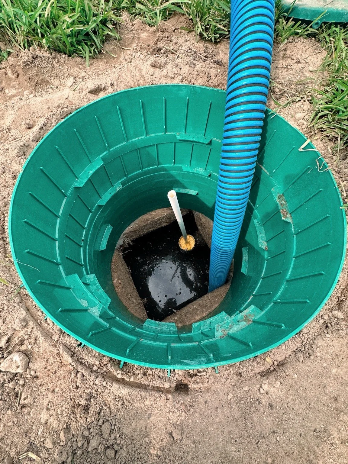 Septic tank being professionally pumped in Polk, Hillsborough, or Pasco County to remove sludge and prevent backups in a residential system.