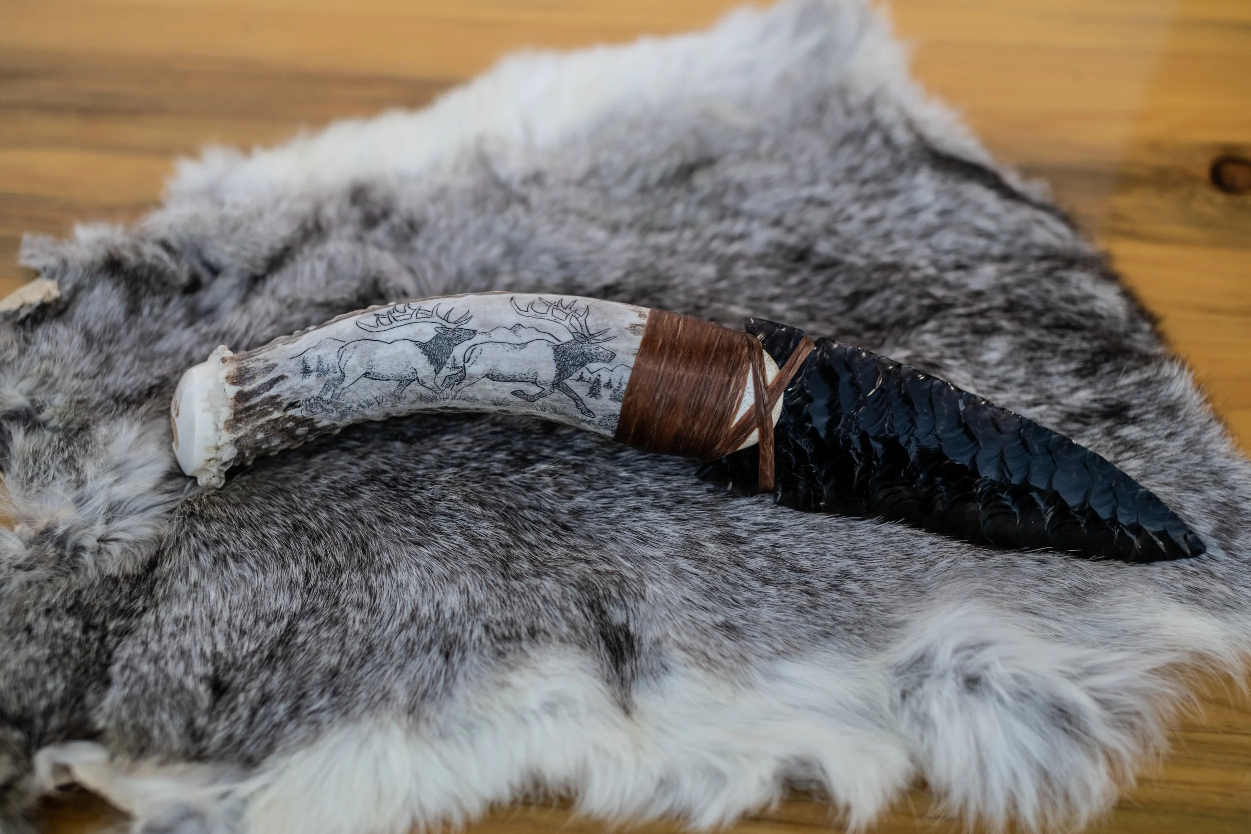 Museum-quality scrimshaw by our master in-house artist transforms elk jaws, deer jaws, wolf jaws, antler, buffalo bone, and ulu handles into living canvases. Detailed scenes of elk, deer, wolf, buffalo, bear, and eagle amid their native landscapes ar