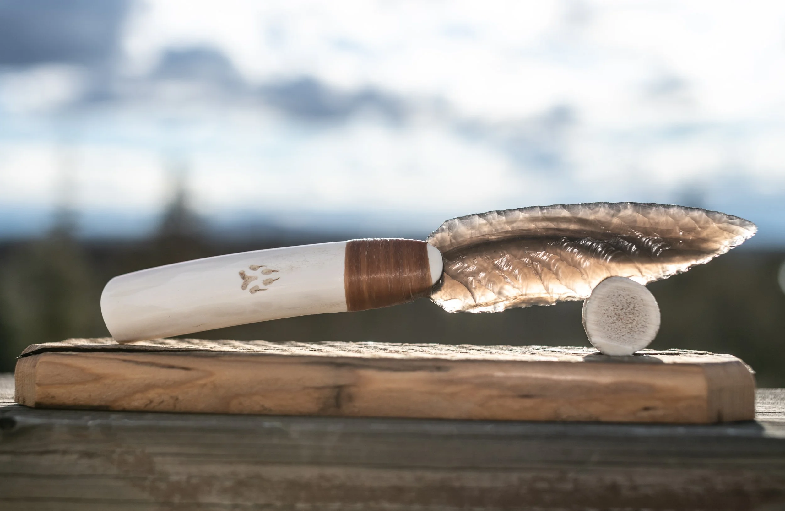 Hand-crafted from authentic reclaimed barn wood and crowned with a naturally shed antler tine, this elegant stand gently cradles and proudly displays your obsidian knife. Timeless rustic character meets perfect function—an essential, heirloom-quality