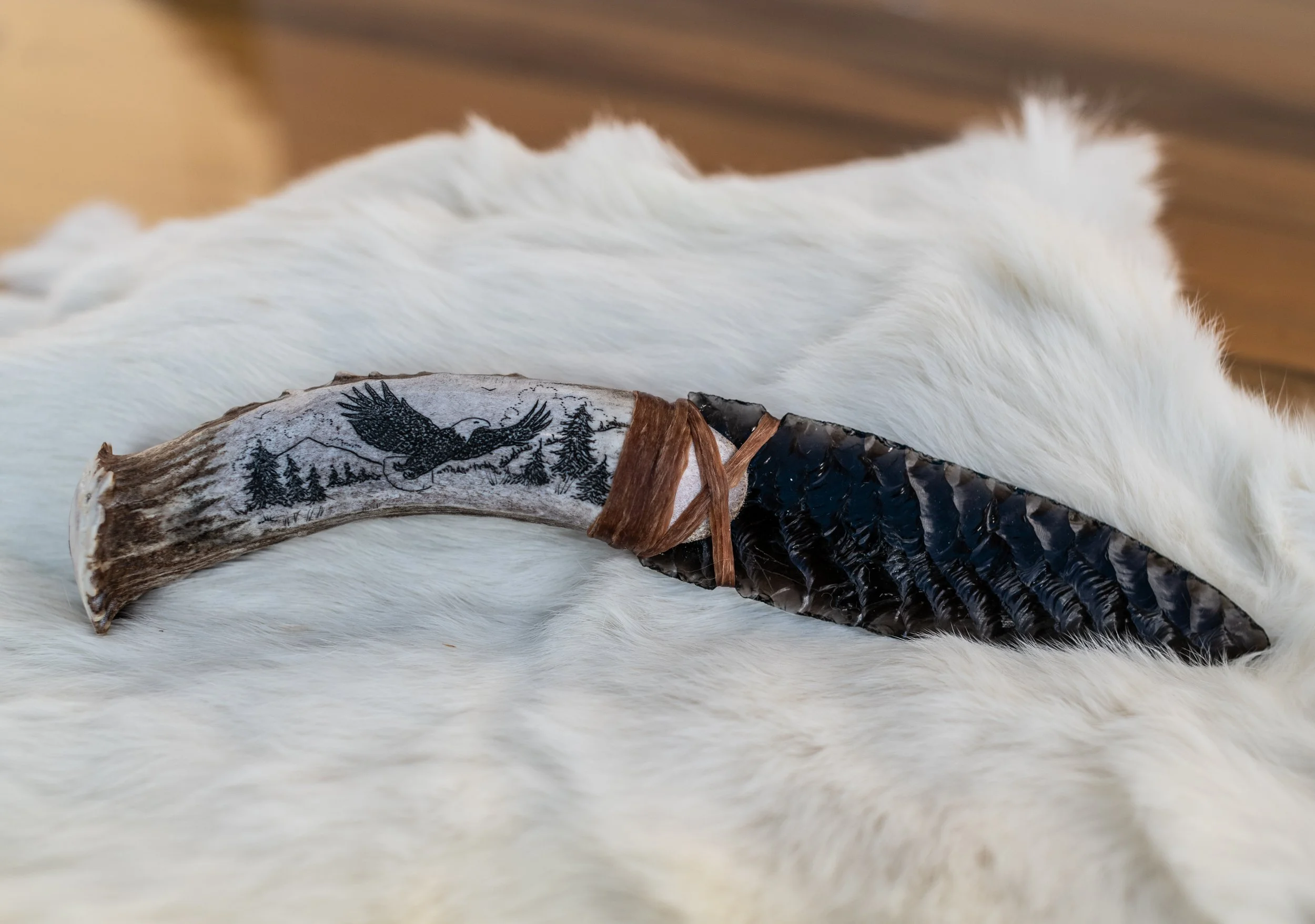 Museum-quality scrimshaw by our master in-house artist transforms elk jaws, deer jaws, wolf jaws, antler, buffalo bone, and ulu handles into living canvases. Detailed scenes of elk, deer, wolf, buffalo, bear, and eagle amid their native landscapes ar