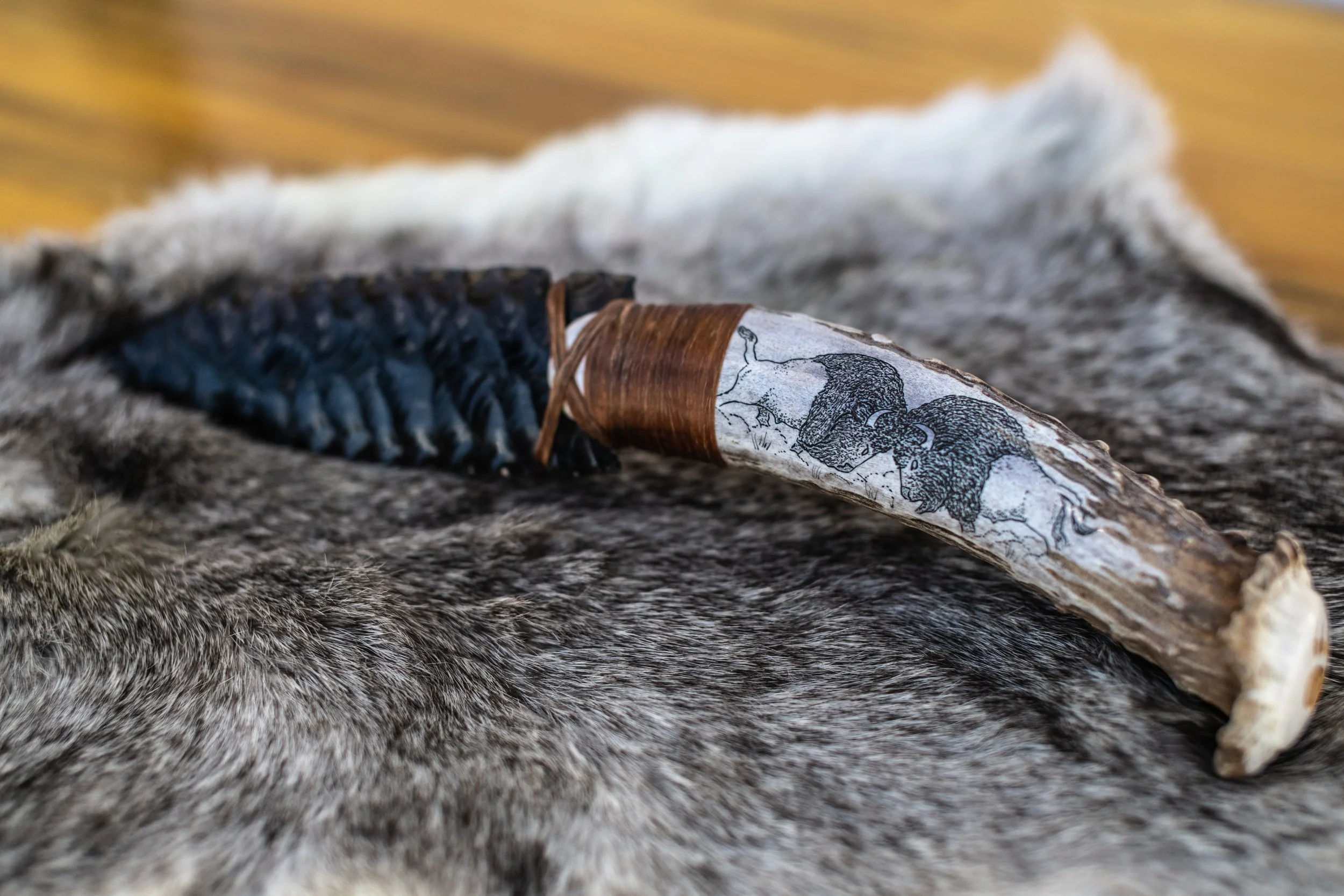 Museum-quality scrimshaw by our master in-house artist transforms elk jaws, deer jaws, wolf jaws, antler, buffalo bone, and ulu handles into living canvases. Detailed scenes of elk, deer, wolf, buffalo, bear, and eagle amid their native landscapes ar