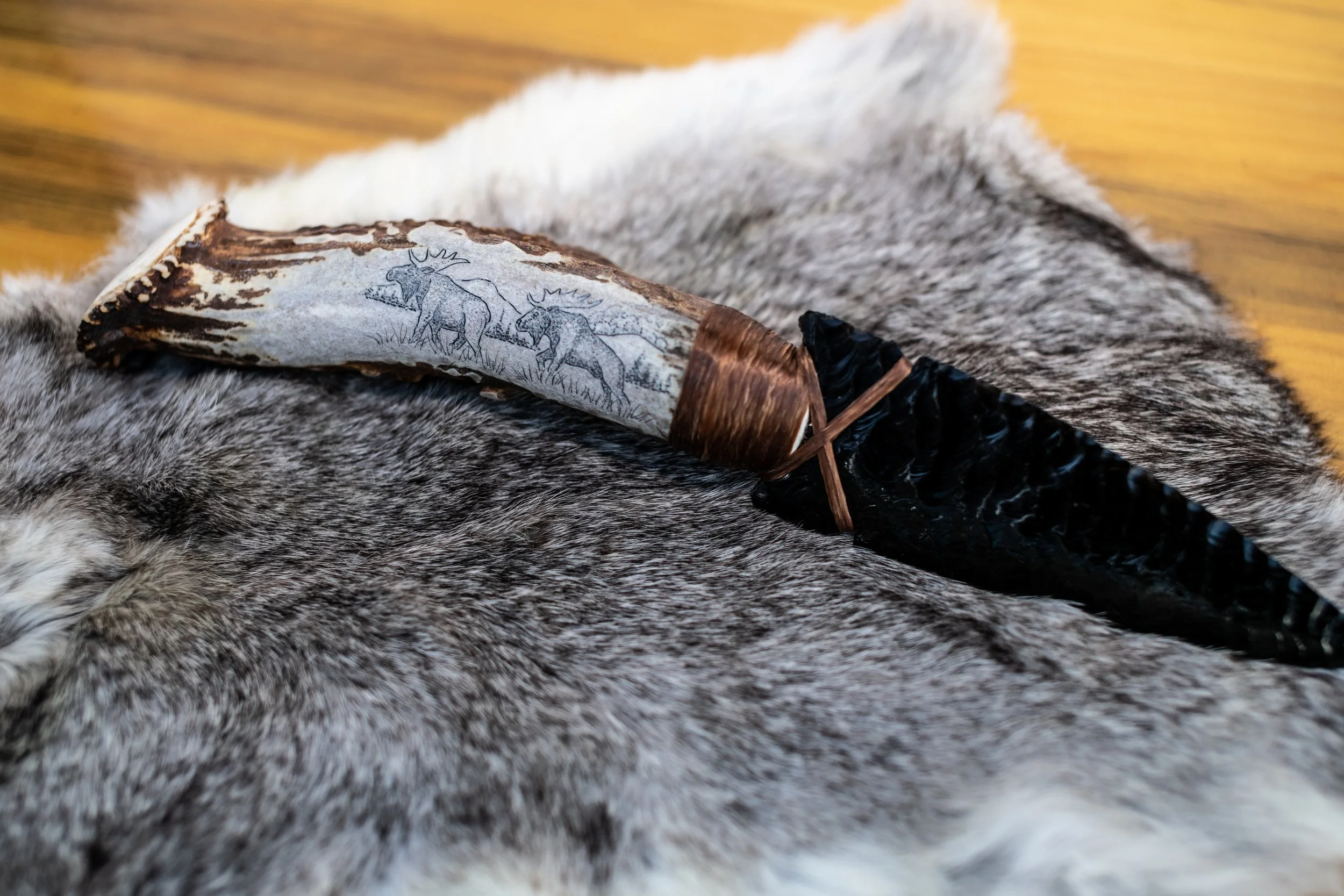 Museum-quality scrimshaw by our master in-house artist transforms elk jaws, deer jaws, wolf jaws, antler, buffalo bone, and ulu handles into living canvases. Detailed scenes of elk, deer, wolf, buffalo, bear, and eagle amid their native landscapes ar