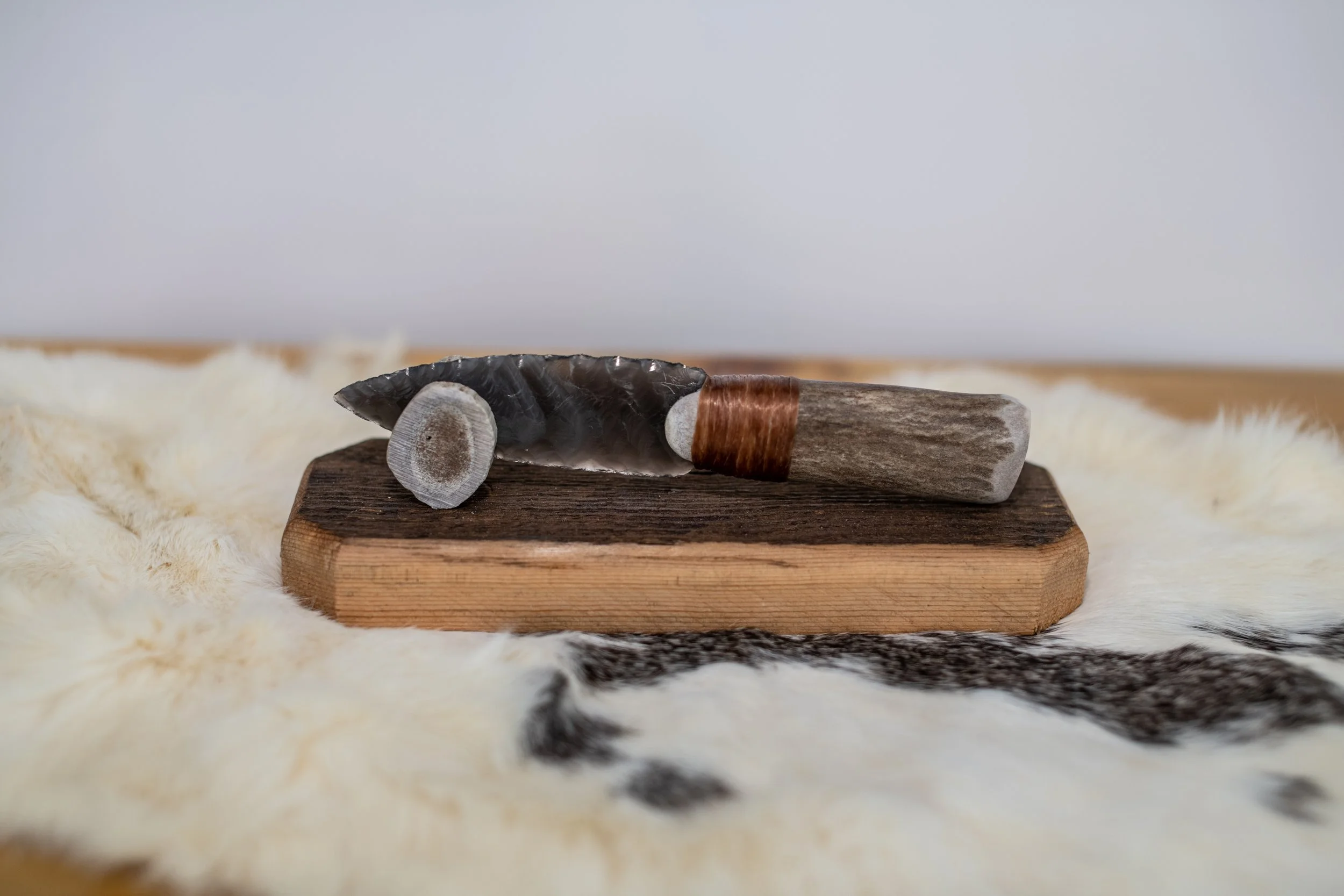 Hand-crafted from authentic reclaimed barn wood and crowned with a naturally shed antler tine, this elegant stand gently cradles and proudly displays your obsidian knife. Timeless rustic character meets perfect function—an essential, heirloom-quality