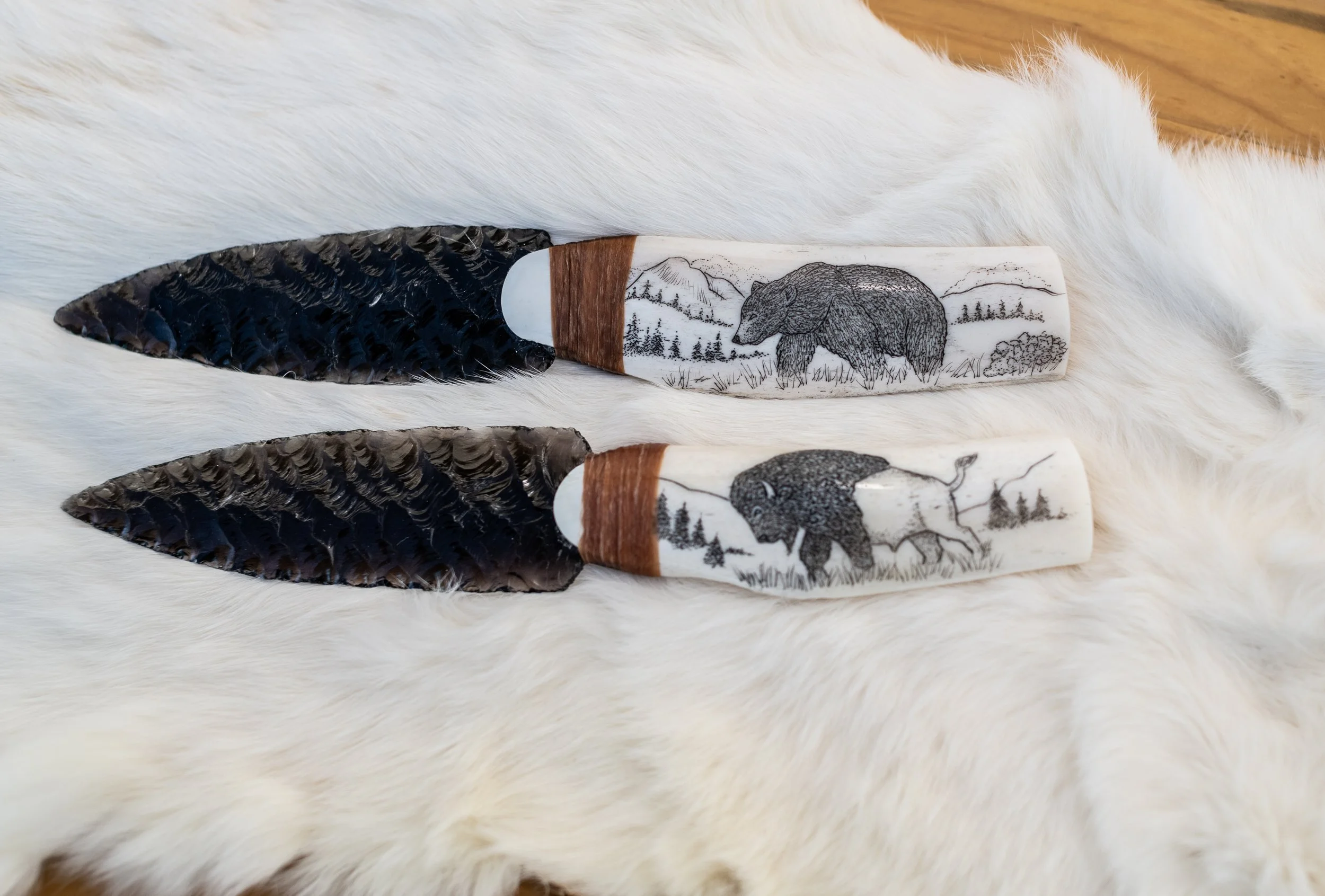 Museum-quality scrimshaw by our master in-house artist transforms elk jaws, deer jaws, wolf jaws, antler, buffalo bone, and ulu handles into living canvases. Detailed scenes of elk, deer, wolf, buffalo, bear, and eagle amid their native landscapes ar