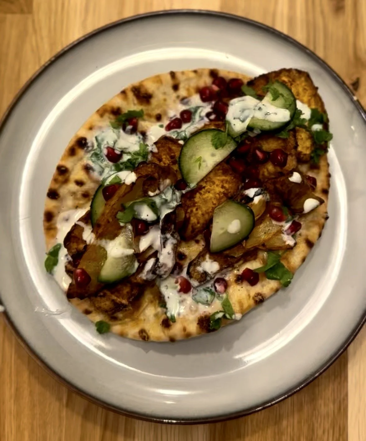 Charred Flatbread with Tikka Veggies, Marinated Tofu, and Pomegranate
