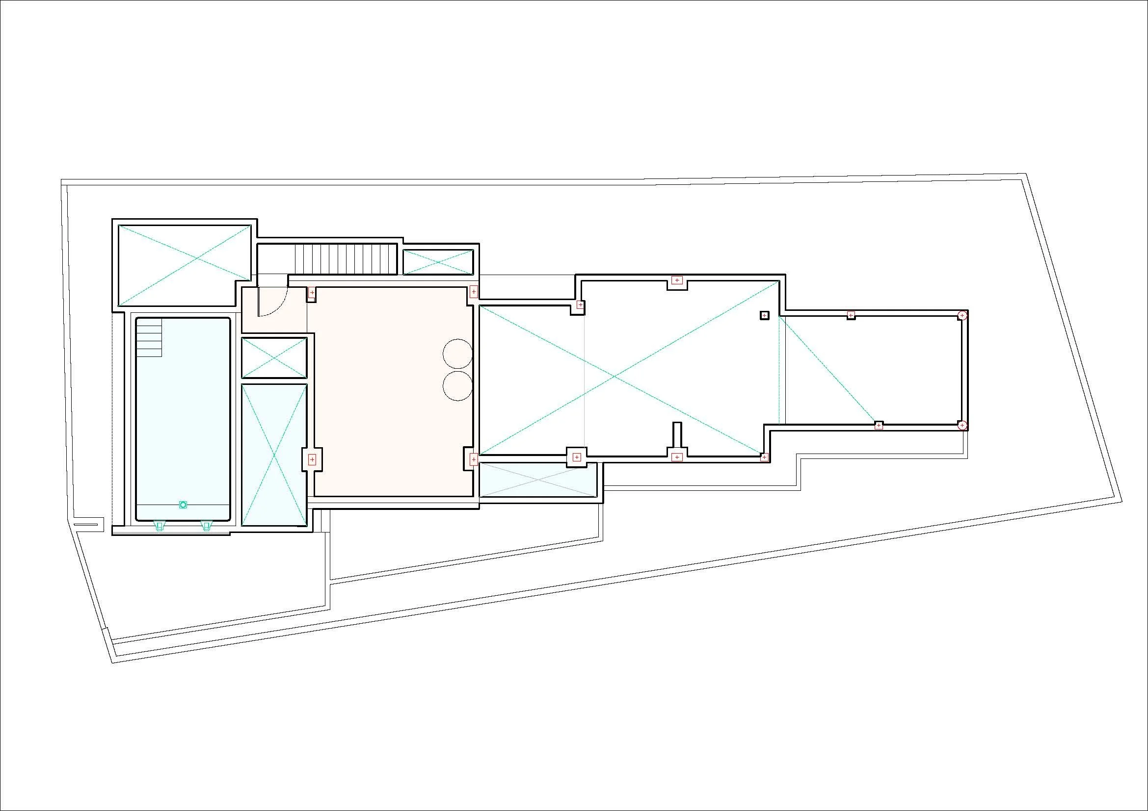 Architectural floor plan of a building showing multiple rooms, including a large room with two smaller circles, an adjacent rectangular room, and external boundaries.