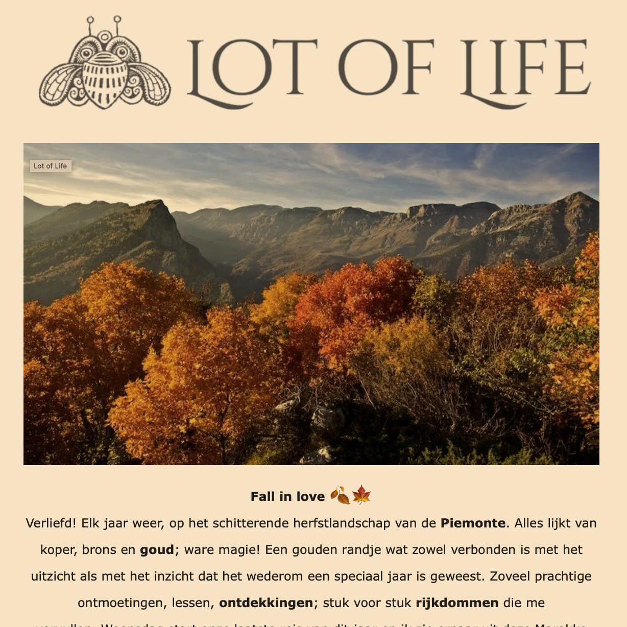 Scenic view of autumn mountains with colorful fall foliage in the foreground and a partly cloudy sky.