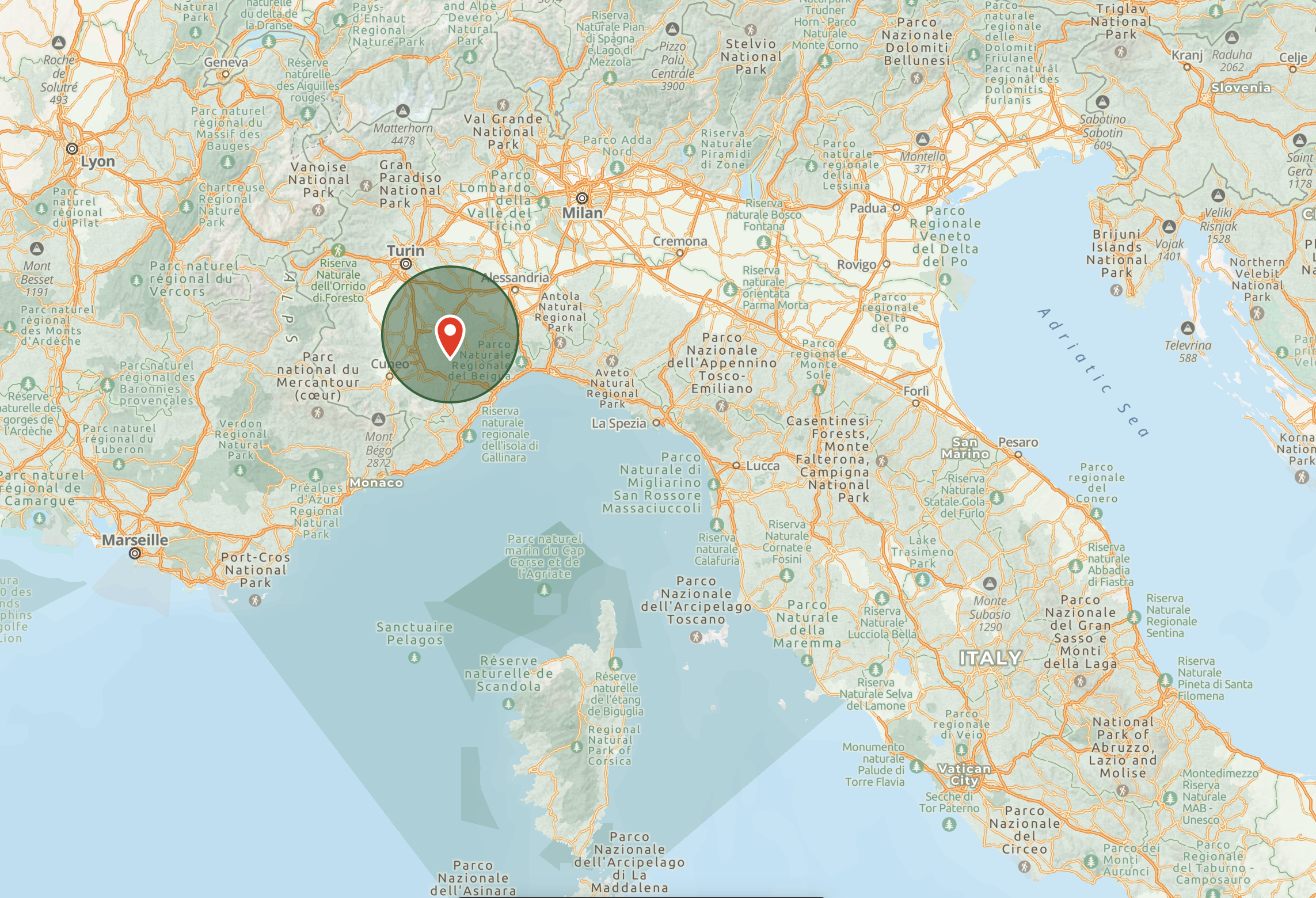 A map of northern Italy showing cities, parks, and natural reserves, with a highlighted circular area around the Cuneo region.