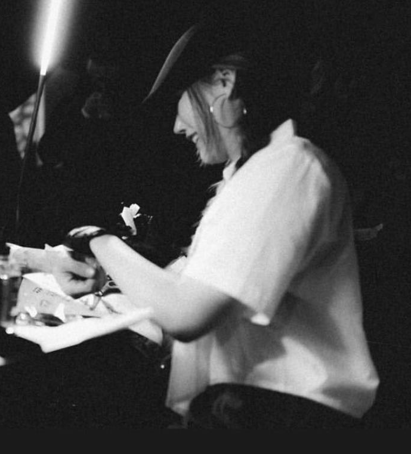 Tattoo artist Kissami is tattooing a client during a custom tattoo session in Toronto.