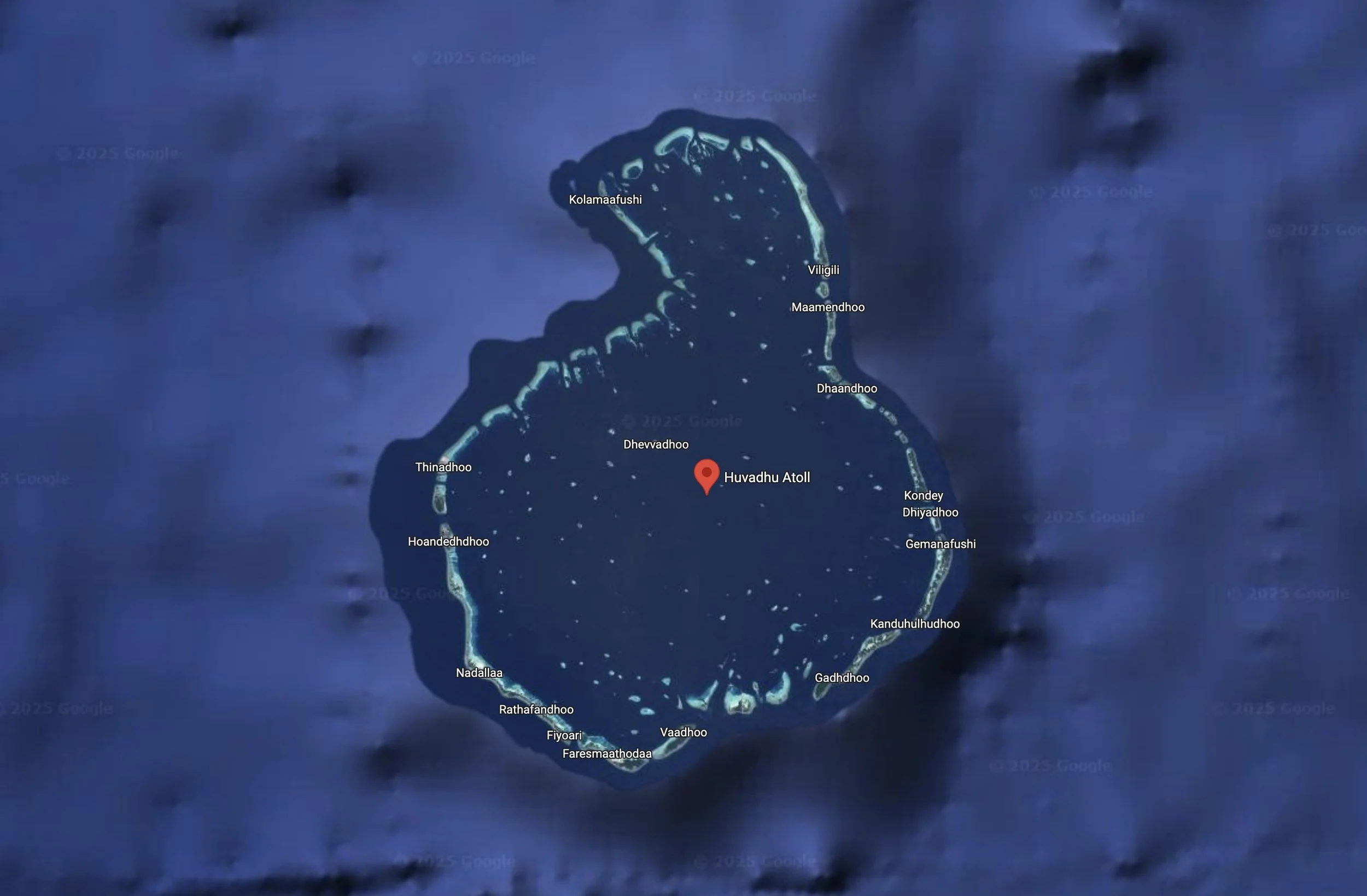 Satellite image of Huvadhu Atoll, with island names labeled around the atoll, including Kolamaafushi, Viligili, Maamendhoo, Dhaandhoo, Kondey, Dhiyadhoo, Gemanafushi, Kanduhulhudhoo, Gadhdoo, Vaadhoo, Faresmaathoda, Fiyoari, Rathafandhoo, Nadallaa, Hoandedhdhoo, Thinadhoo, and Dhevvadhoo, surrounded by blue ocean water.