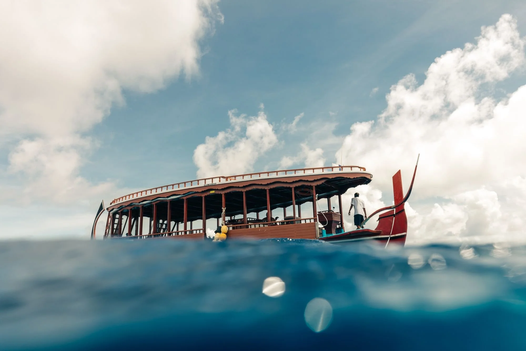Traditional Maldivian dive dhoni on the water in Huvadhu Atoll