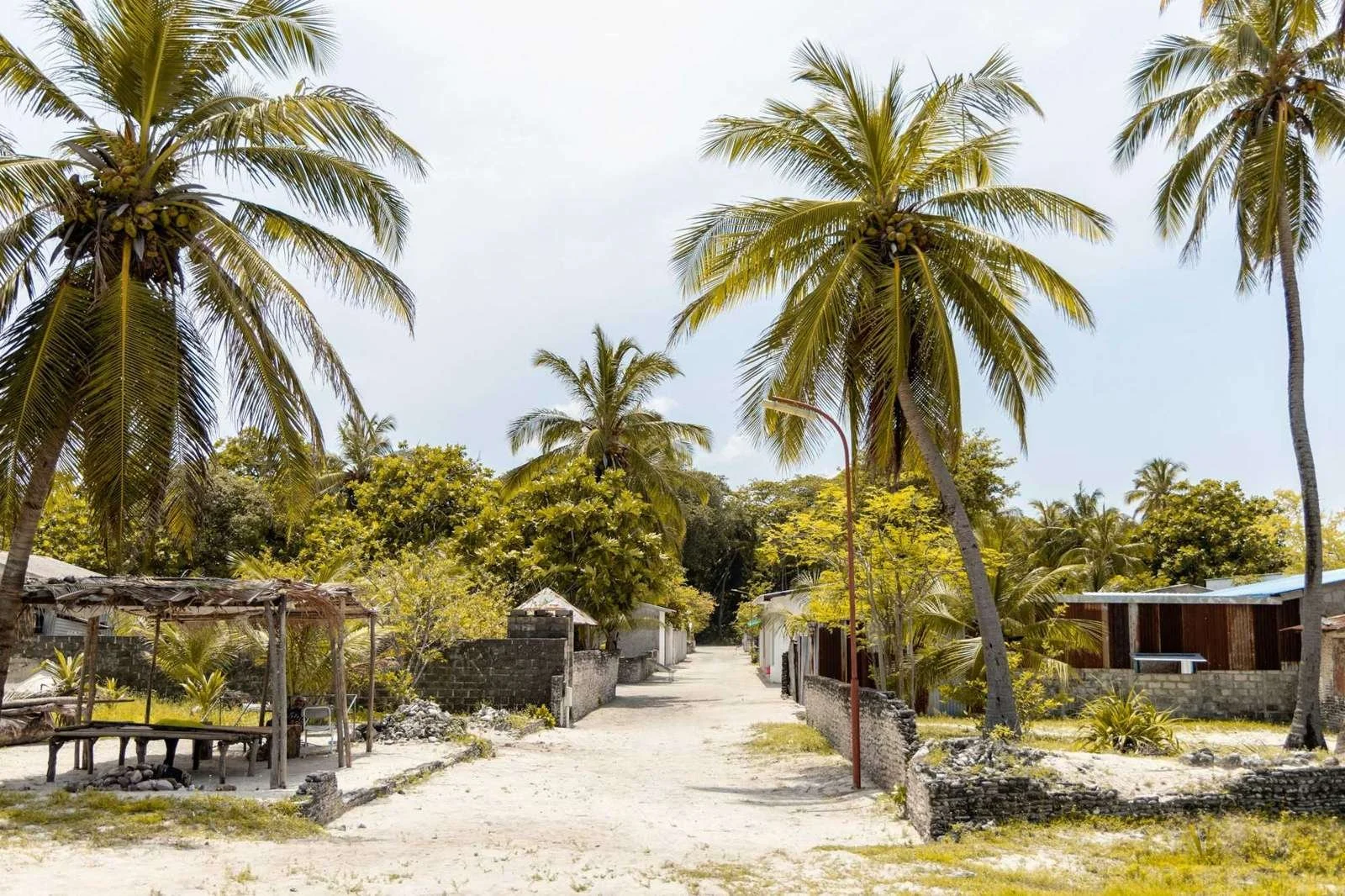 Sandy village street on a local island in Huvadhu Atoll, Maldives