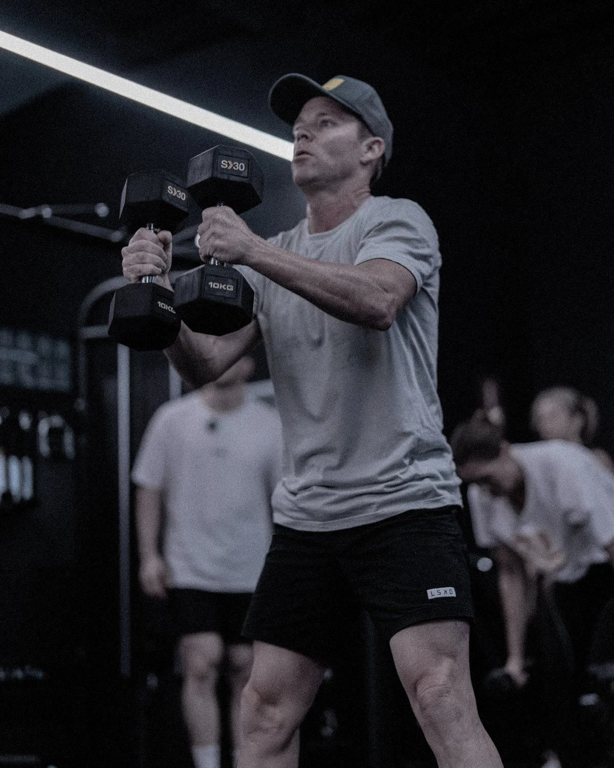 Coach leading a group fitness class at RARE