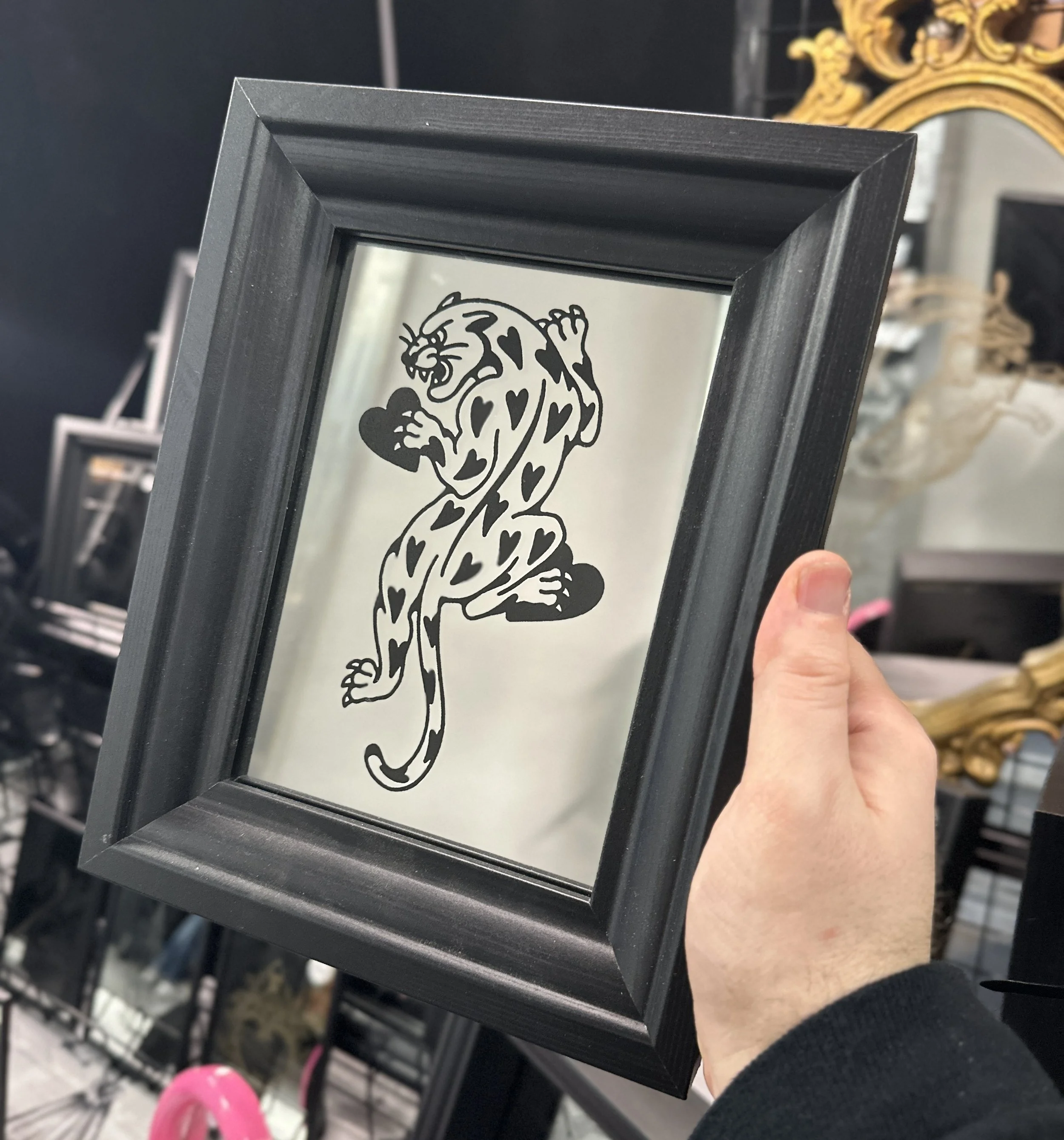 Black Framed Mirror with a Jaguar of Hearts