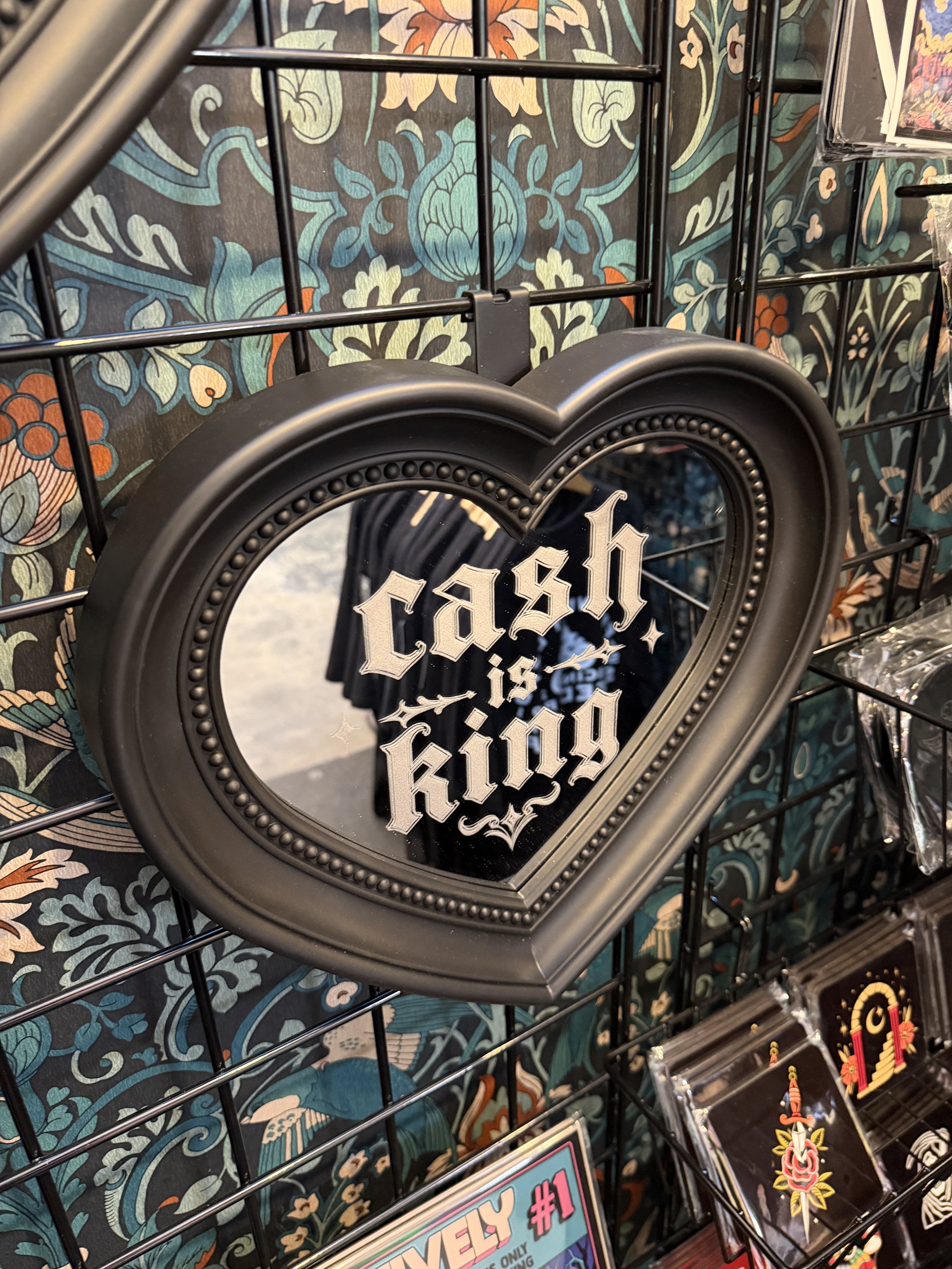 Etched heart mirror with blackletter "cash is king" lettering