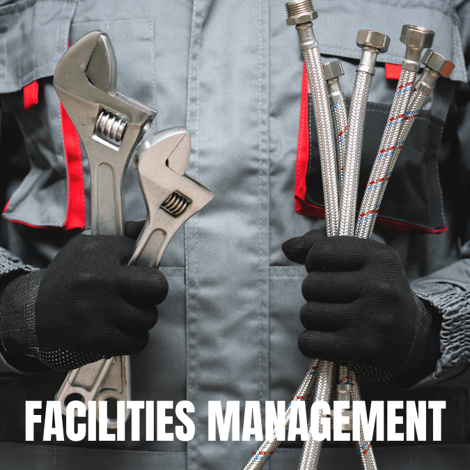 A worker in a gray uniform with red accents holds two large wrenches and several flexible metal hoses. Text below reads "Facilities Management."