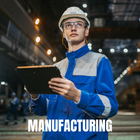 A worker in a blue uniform and hard hat, holding a tablet, stands in a factory with bright lights. The word "Manufacturing" is at the bottom.